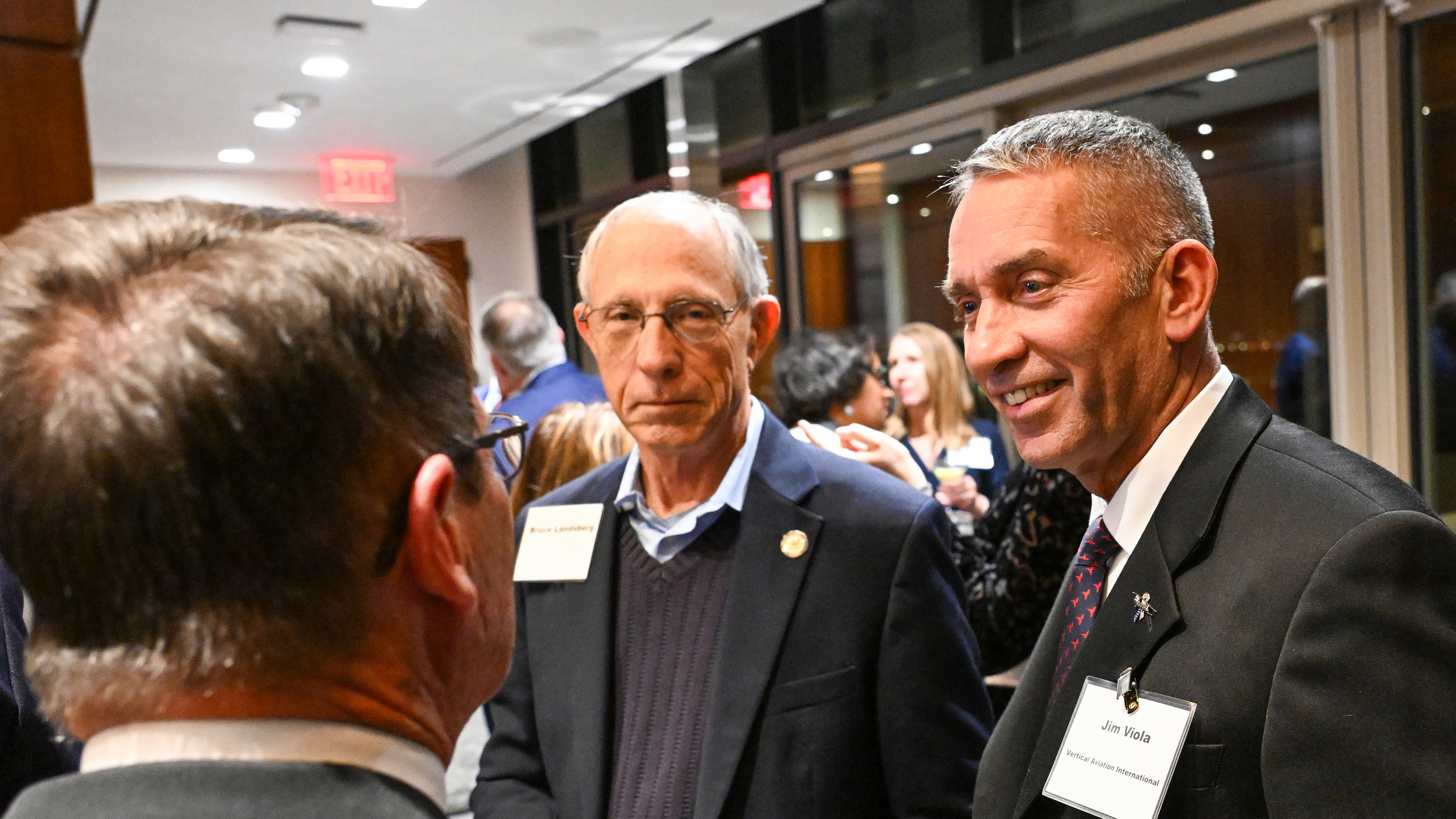 James Viola, right, talks with former AOPA senior staff members Bruce Landsberg and Tom Haines during a recent AOPA gathering in Washington, D.C. Photo by David Tulis.