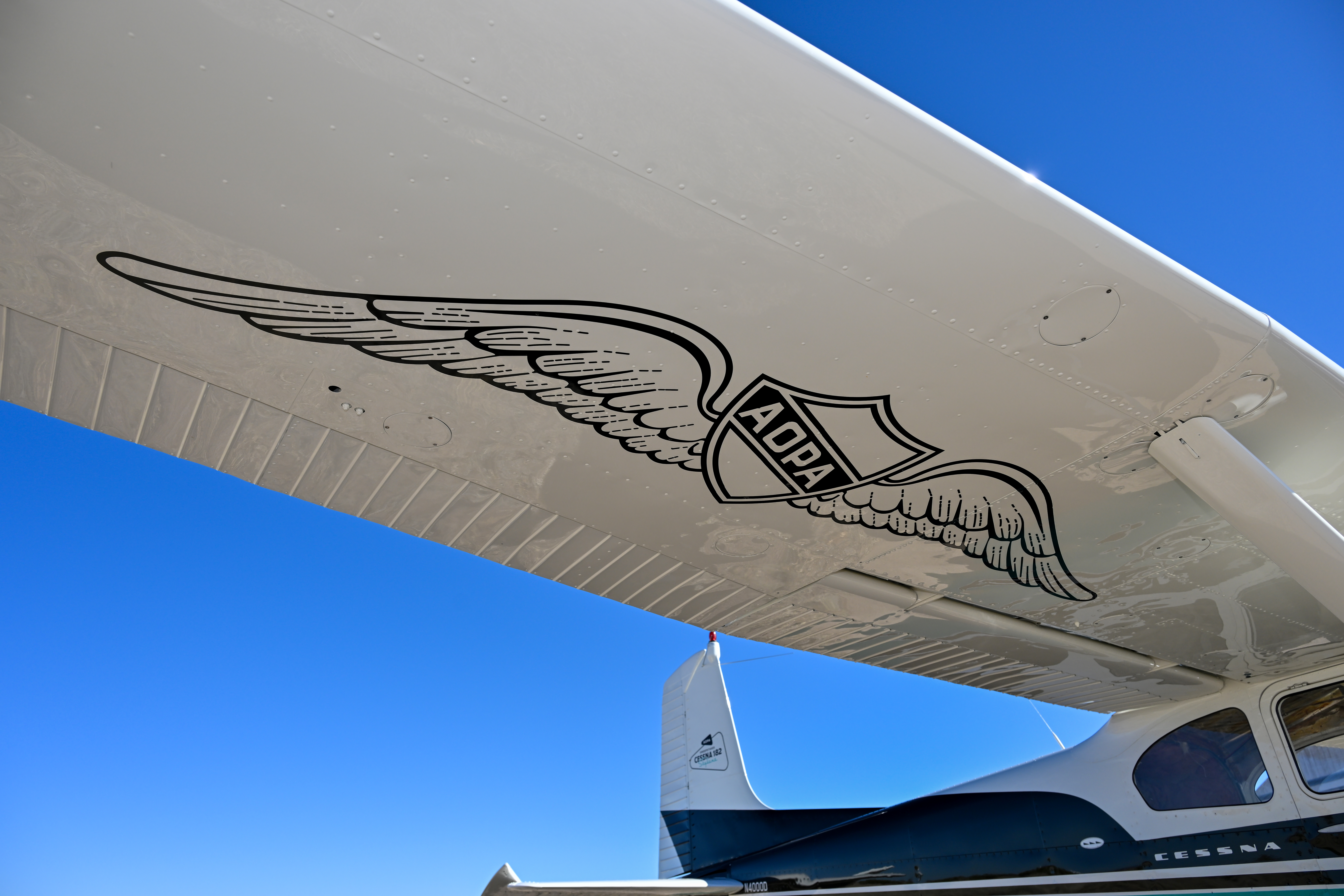 A vintage AOPA logo is painted on the bottom of the wing on the AOPA Sweepstakes Cessna 182 Skylane. Photo by David Tulis.