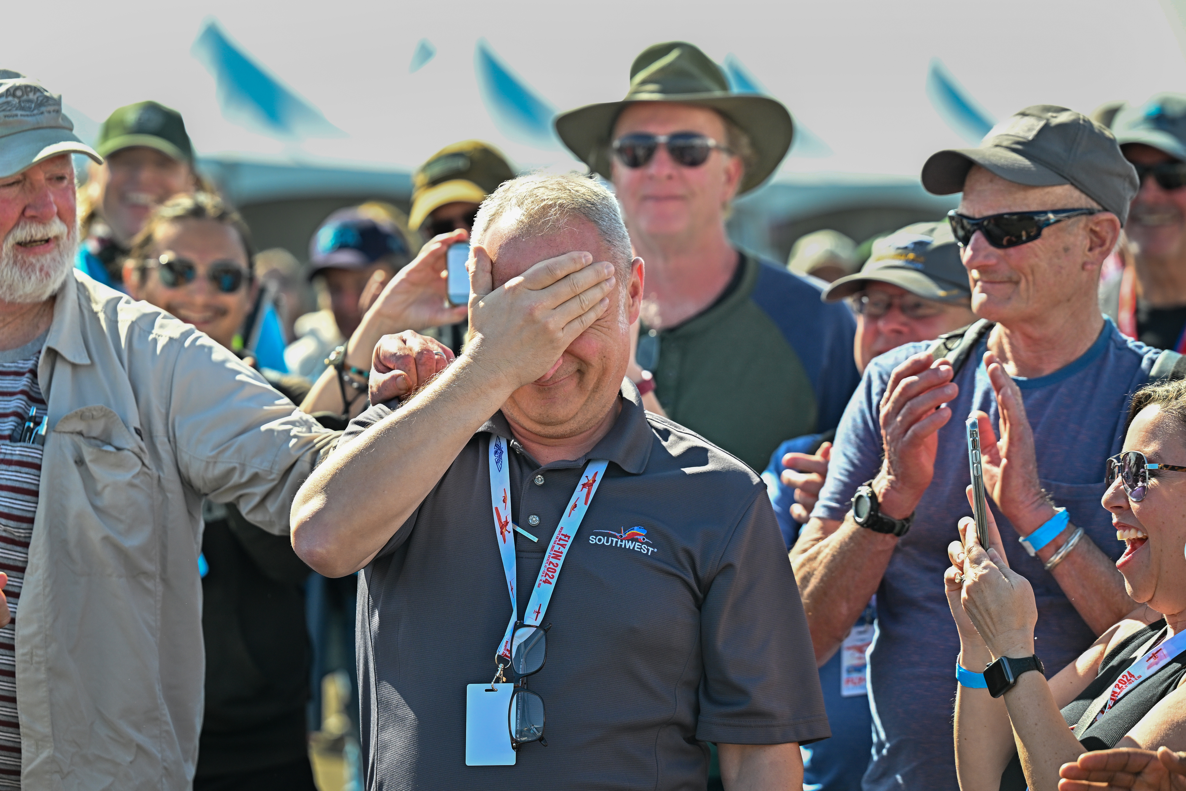 Cliff Gurske reacts to learning he is the winner of the AOPA Sweepstakes Cessna 170B. Photo by David Tulis.