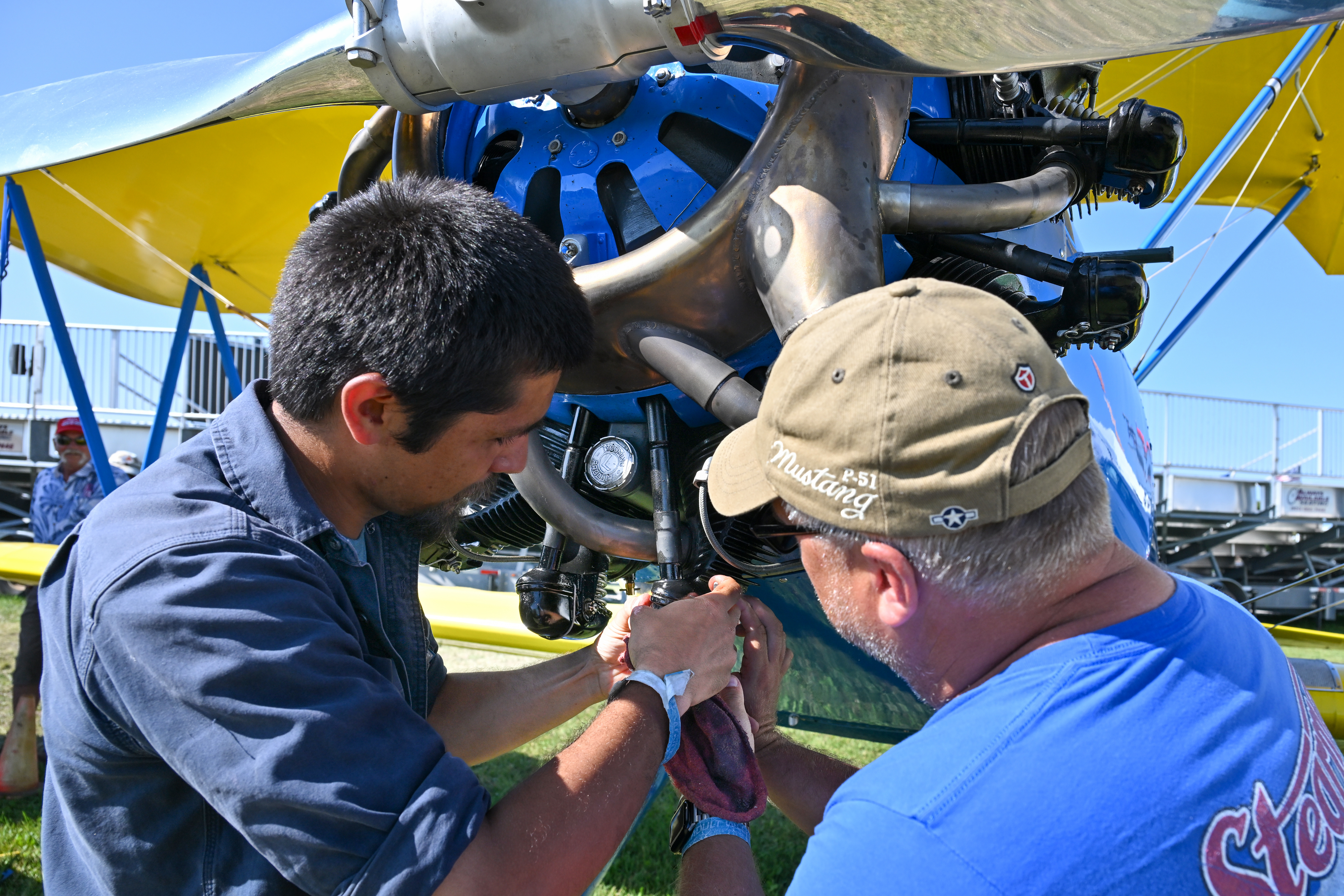 Scooter Reid, a mechanic and pilot with the Western Antique Aeroplane & Automobile Museum, performs routine maintenance on a one-of-a-kind 1933 Stearman Model 70 biplane flown from Hood River, Oregon. Photo by David Tulis.