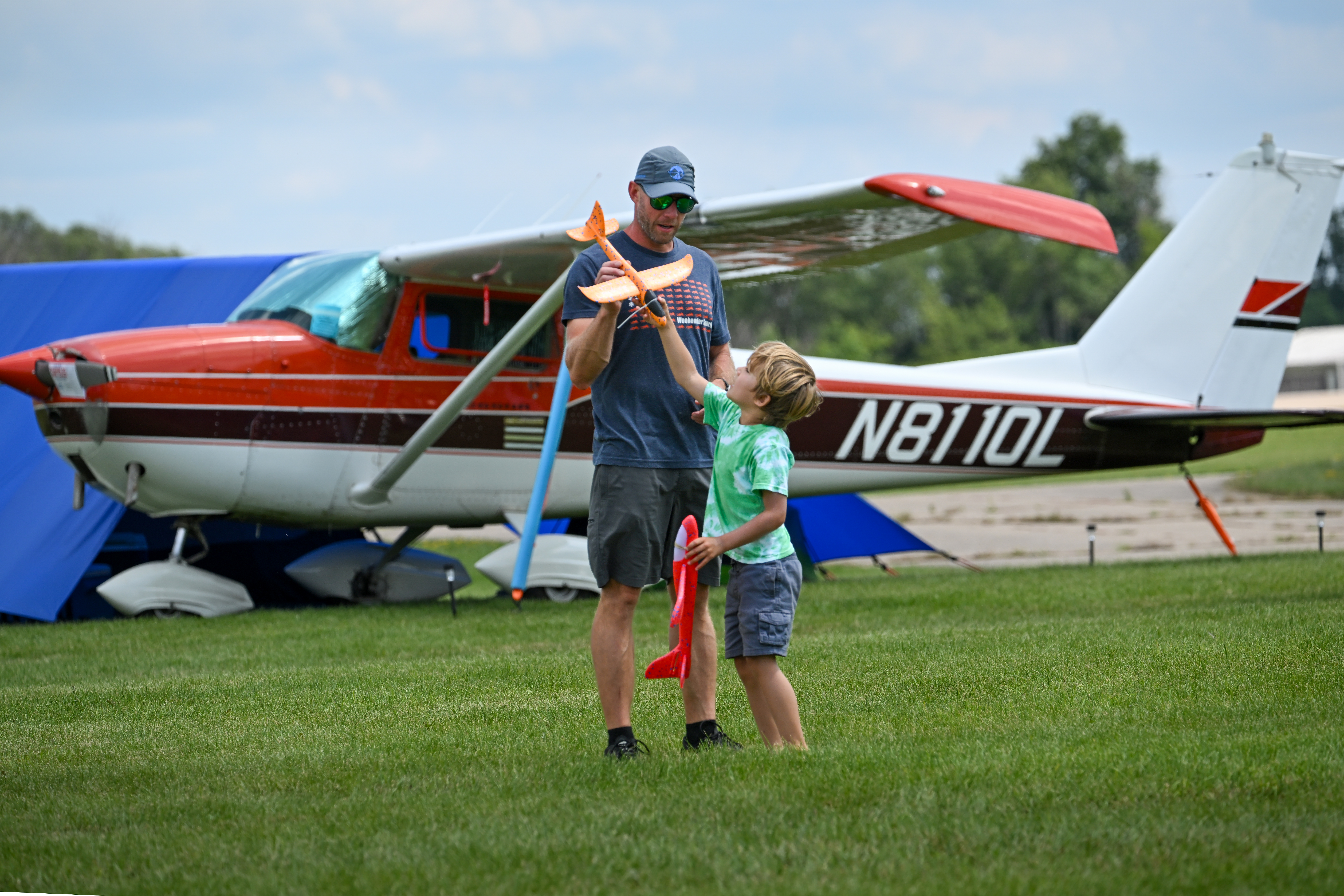Lucas and Brian Oliver of Colorado fly gliders as they wait for the show to begin. Photo by David Tulis.