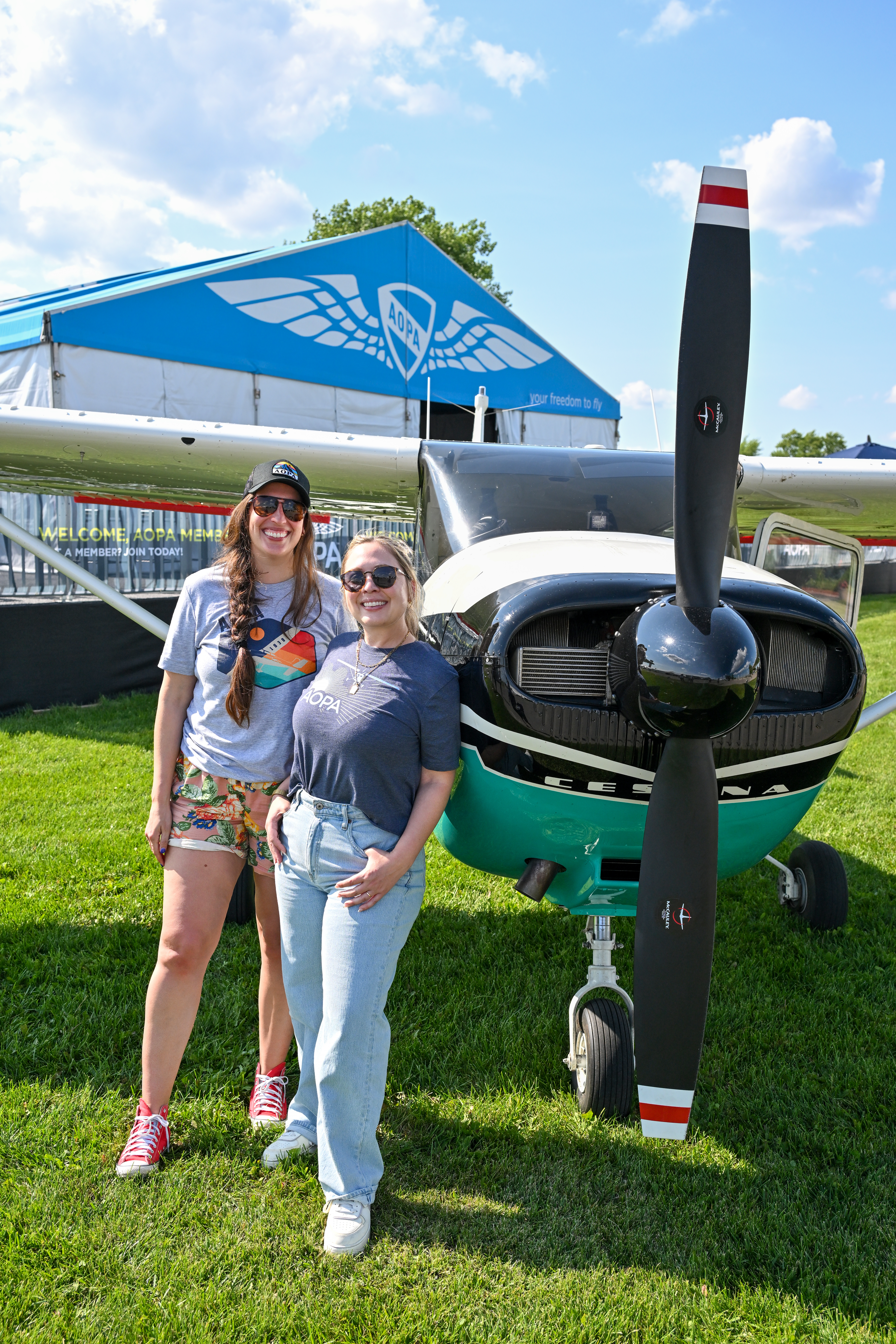AOPA Sweepstakes Cessna 182 project managers Alicia Herron and Niki Britton arrive at the AOPA campus. Photo by David Tulis.