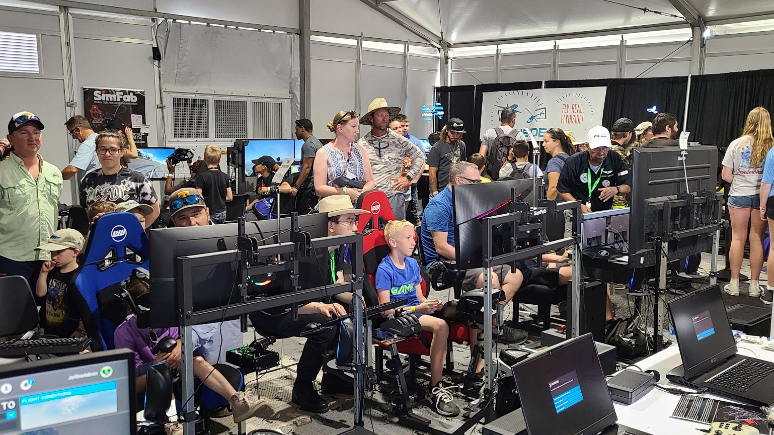 A tent full of simulators at the Sun 'n Fun Aerospace Expo in April proved popular among pilots, as well as future pilots. Photo courtesy of the Flight Simulation Association.