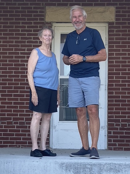The farm outside Postville, Iowa, is still in good hands with Ms. Verta Kerr, who welcomed the author and his wife into this old brick farmhouse 31 years after welcoming my mother and me to the farm. Photo courtesy of Greg Anderson.