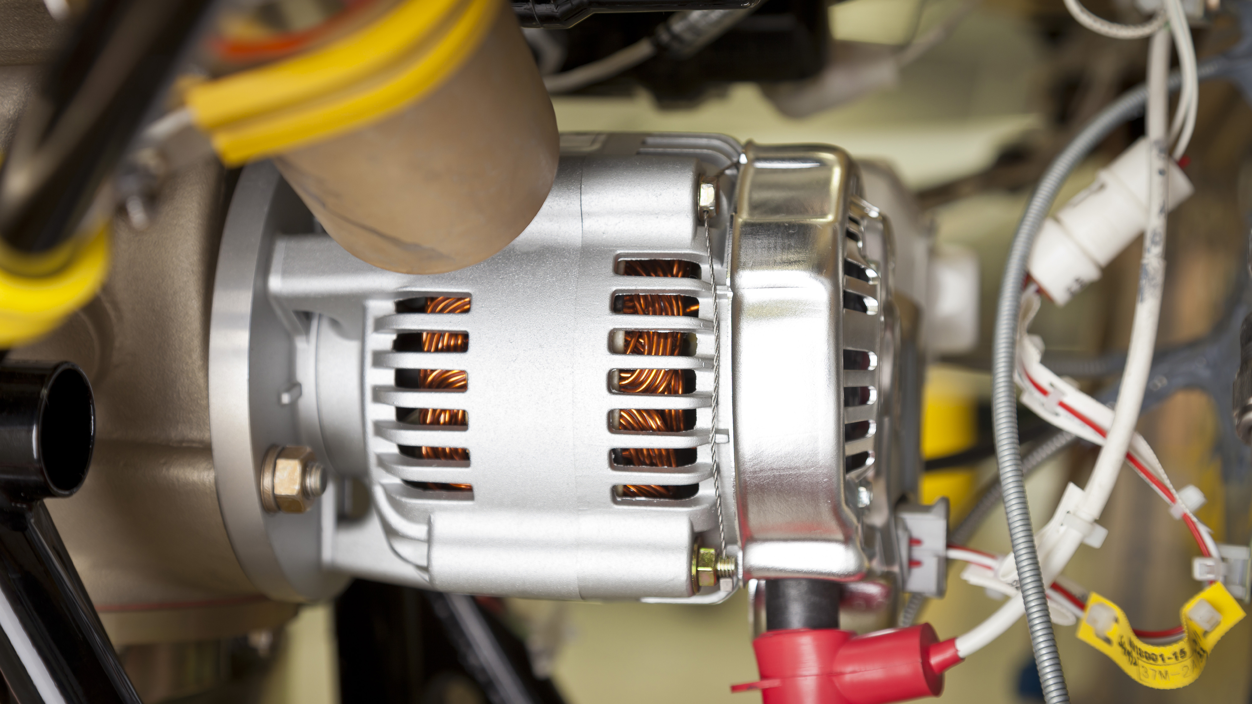 Alternators like this one (installed on a Cessna 162) provide electrical power efficiently, and generally replaced generators as the onboard aircraft electrical power source of choice after 1960. Photo by Mike Fizer.
