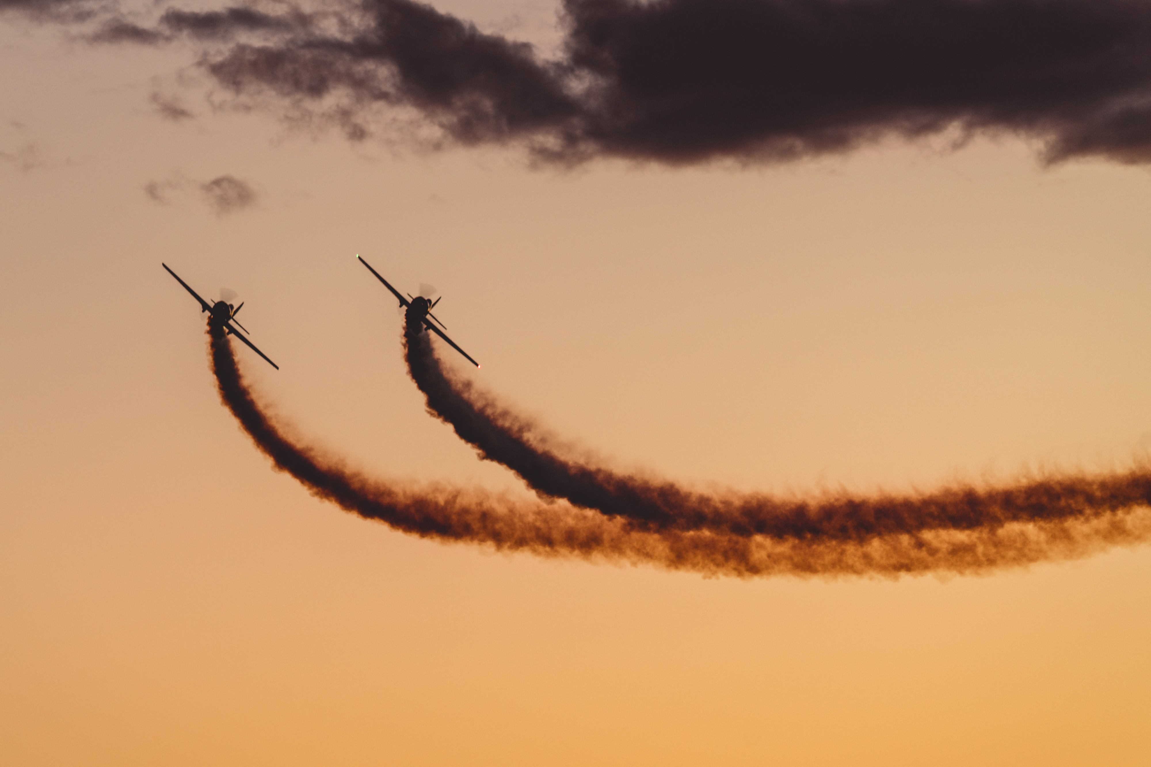 Red Thunder Airshows’ Yak 50s perform at the night airshow. Photo by Jake Teague.