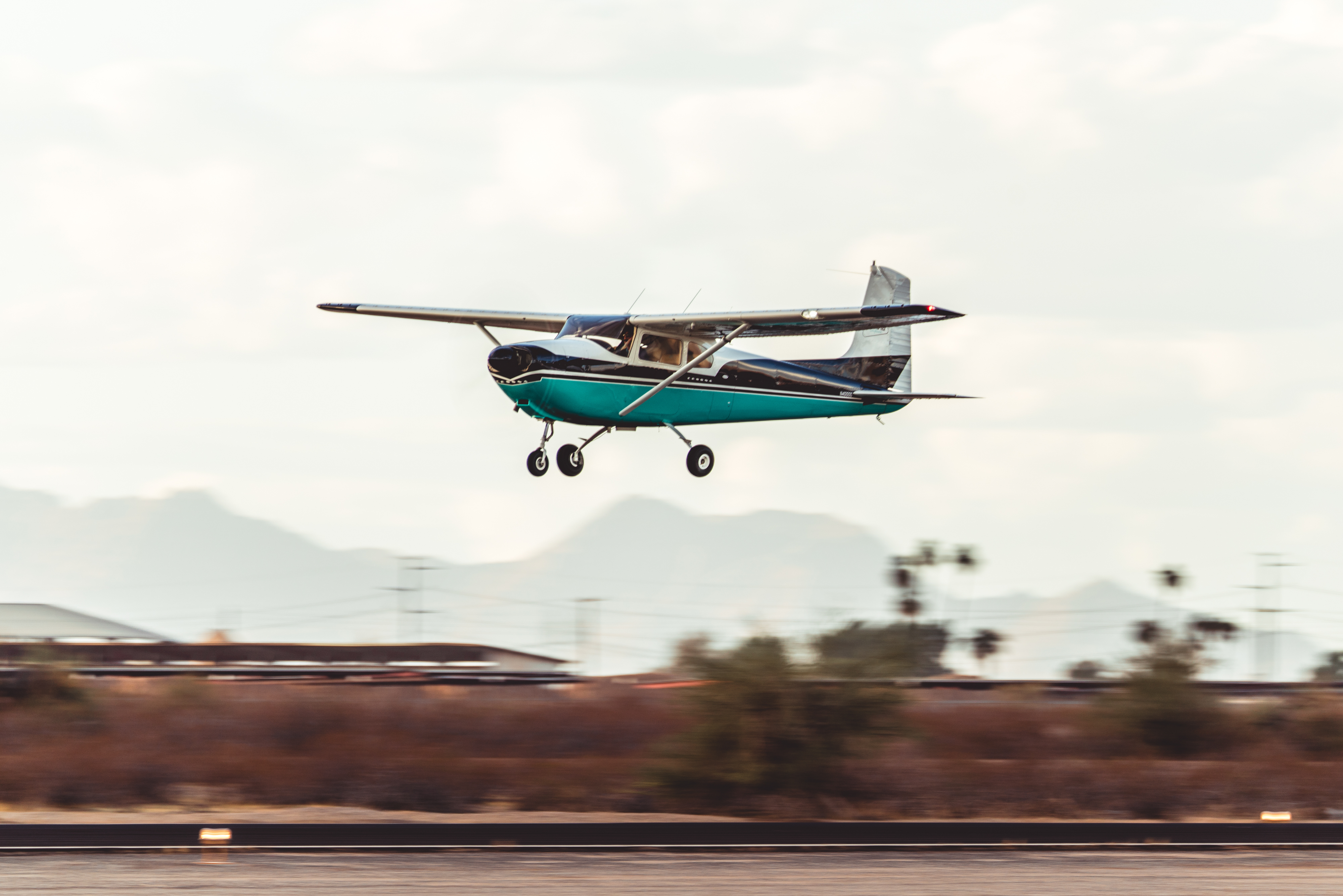 The AOPA Sweepstakes Cessna 182 performs a flyby during an airshow at the Buckeye Air Fair. Photo by Jake Teague.