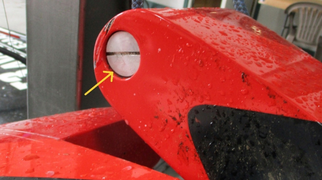 The right-side elevator counterweight container on Rob Holland's MXS was found with the threaded counterweight compartment plug in place. NTSB photo.