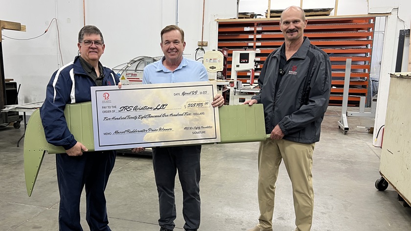 David Lauren of SRS Aviation (center) accepts the Manuel Maciel  Ruddervator Prize, presented by American Bonanza Society Air Safety Foundation Executive Director Thomas Turner (left) and ABS board member Bill Van Lent (right). Photo courtesy of the American Bonanza Society.