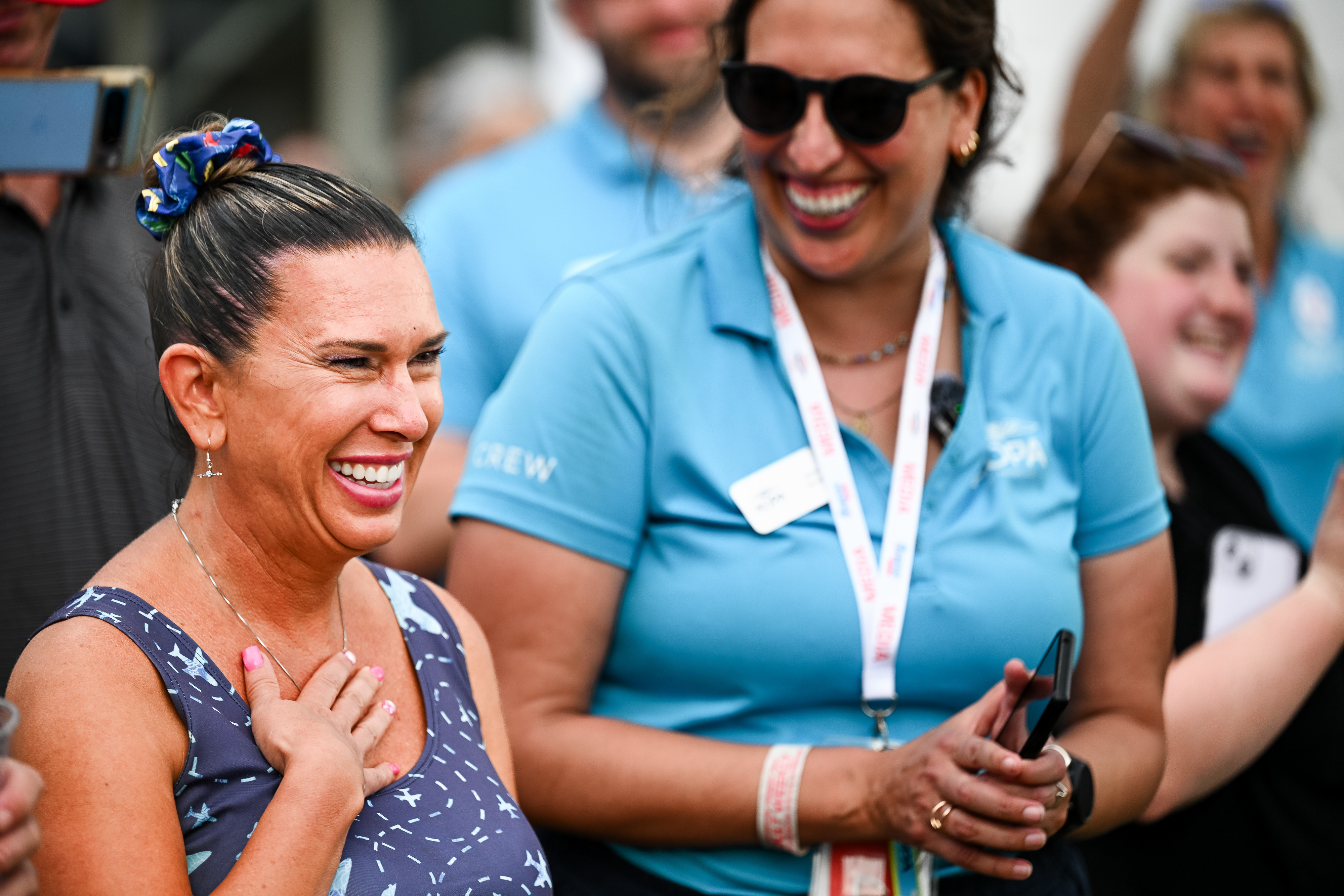 Jennifer Hortman reacts after hints reveal she is the winner of the 1958 AOPA Sweepstakes Cessna 182. Photo by David Tulis.