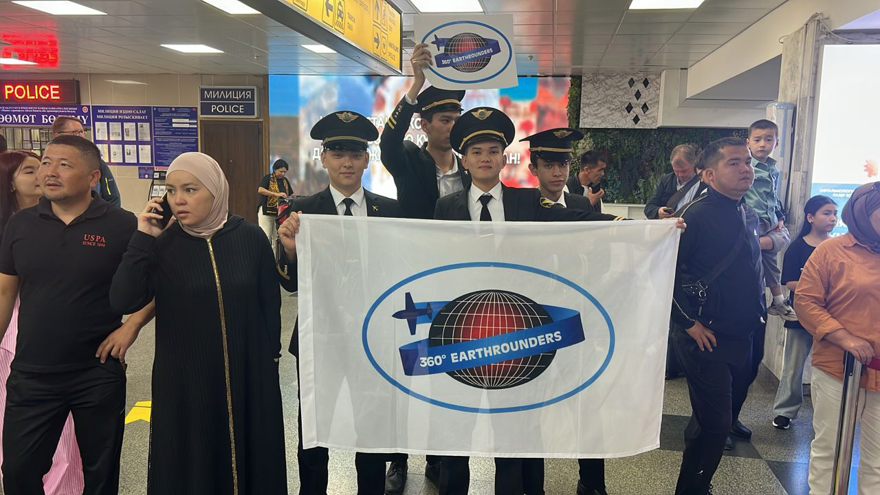 Kyrgyz pilots welcome the Earthrounders. Photo courtesy of Dierk Reuter.