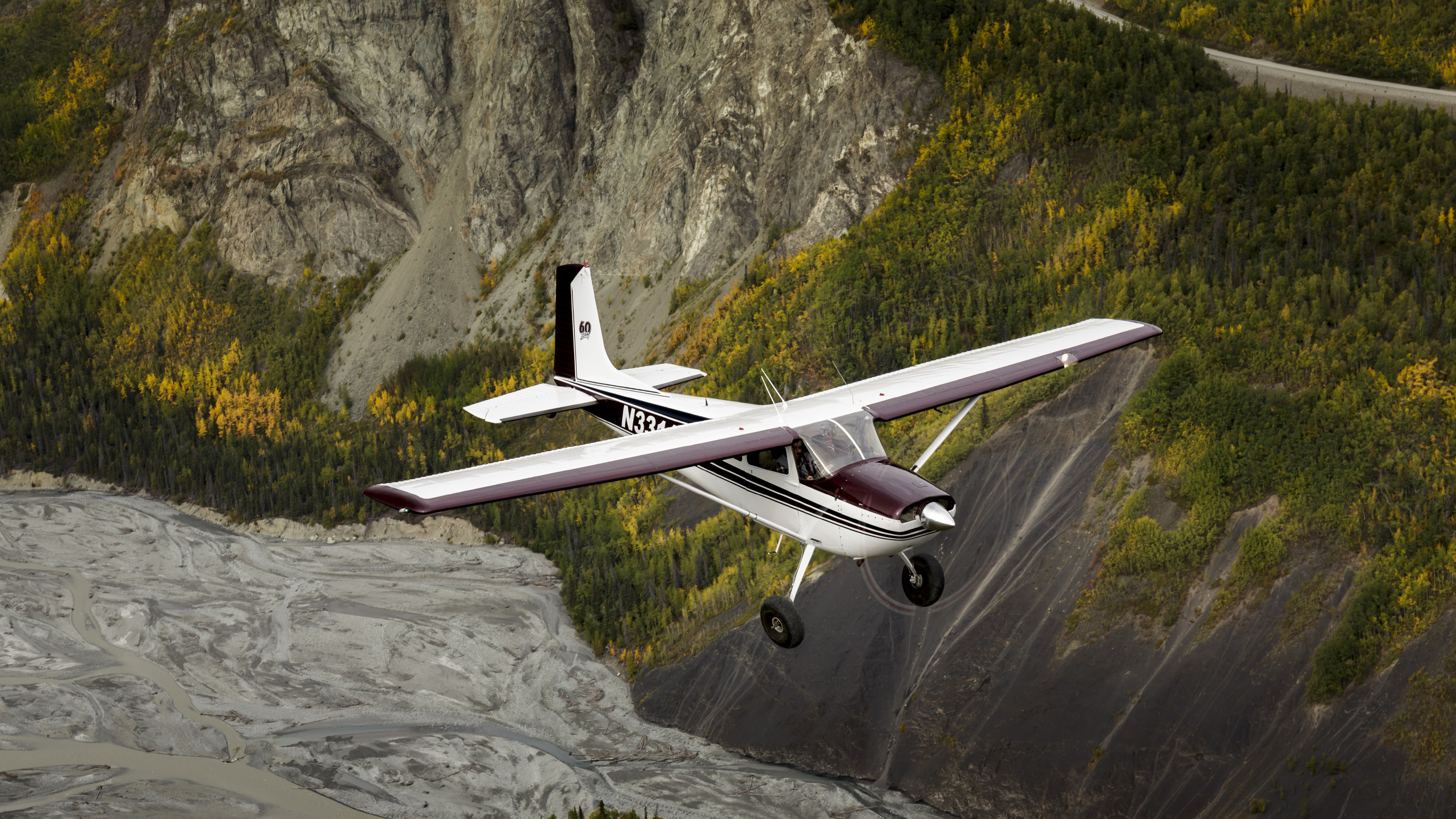 A Cessna 180, pictured here over Alaska, is among many aircraft that are larger and more capable than light sport aircraft which pilots will be able to fly exercising sport pilot privileges as of October 22. Photo by Mike Fizer.