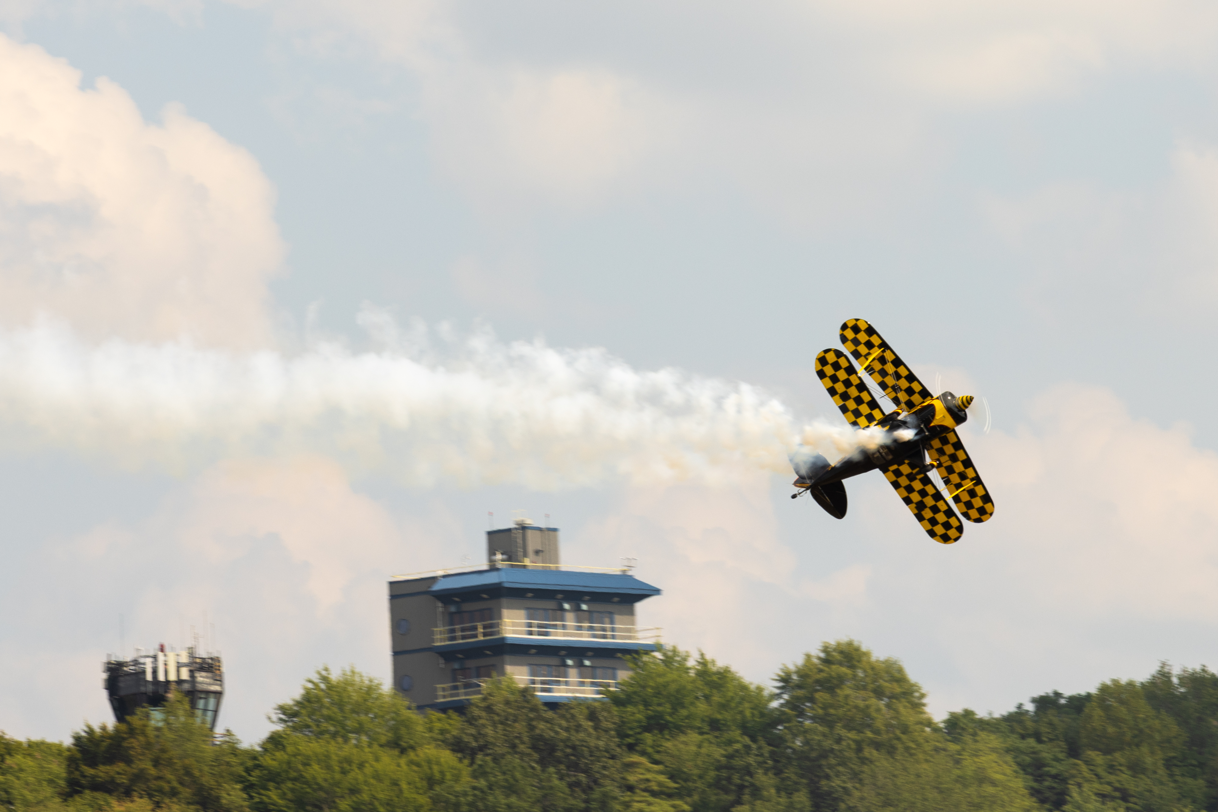 A Pitts S-2B flies by during the airshow practice on August 15. Photo by Rebecca Boone.