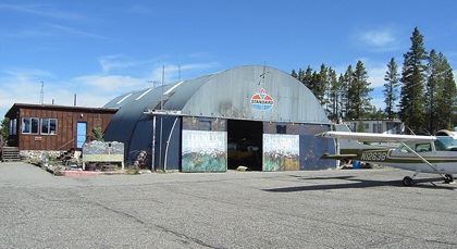 A rustic FBO (left) and primary hangar greeted pilots including the author in 2005 to the highest elevation general aviation airport in North America. Photo by Greg Anderson.