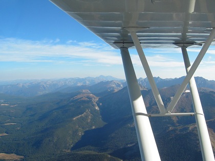 A view looking north just over Rollins Pass westbound. Terrain in the pass rises to 11,671 feet msl. Higher peaks include Longs Peak in the distance at 14,259 feet. Photo by Greg Anderson.