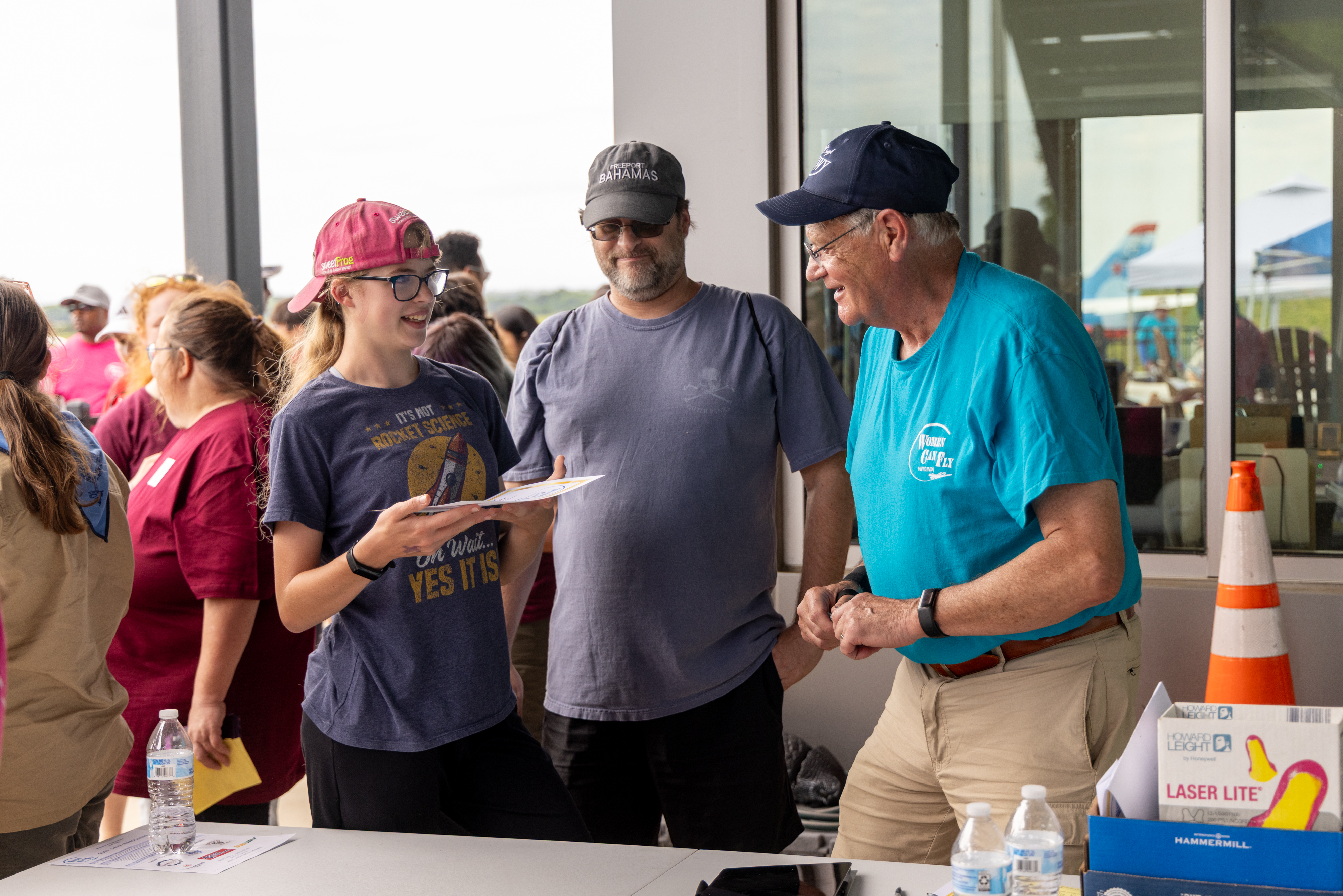 Virginia Higgins and her father smile with pilot Bob Taylor after her first flight in a Piper Cherokee 180. Photo by Rebecca Boone.