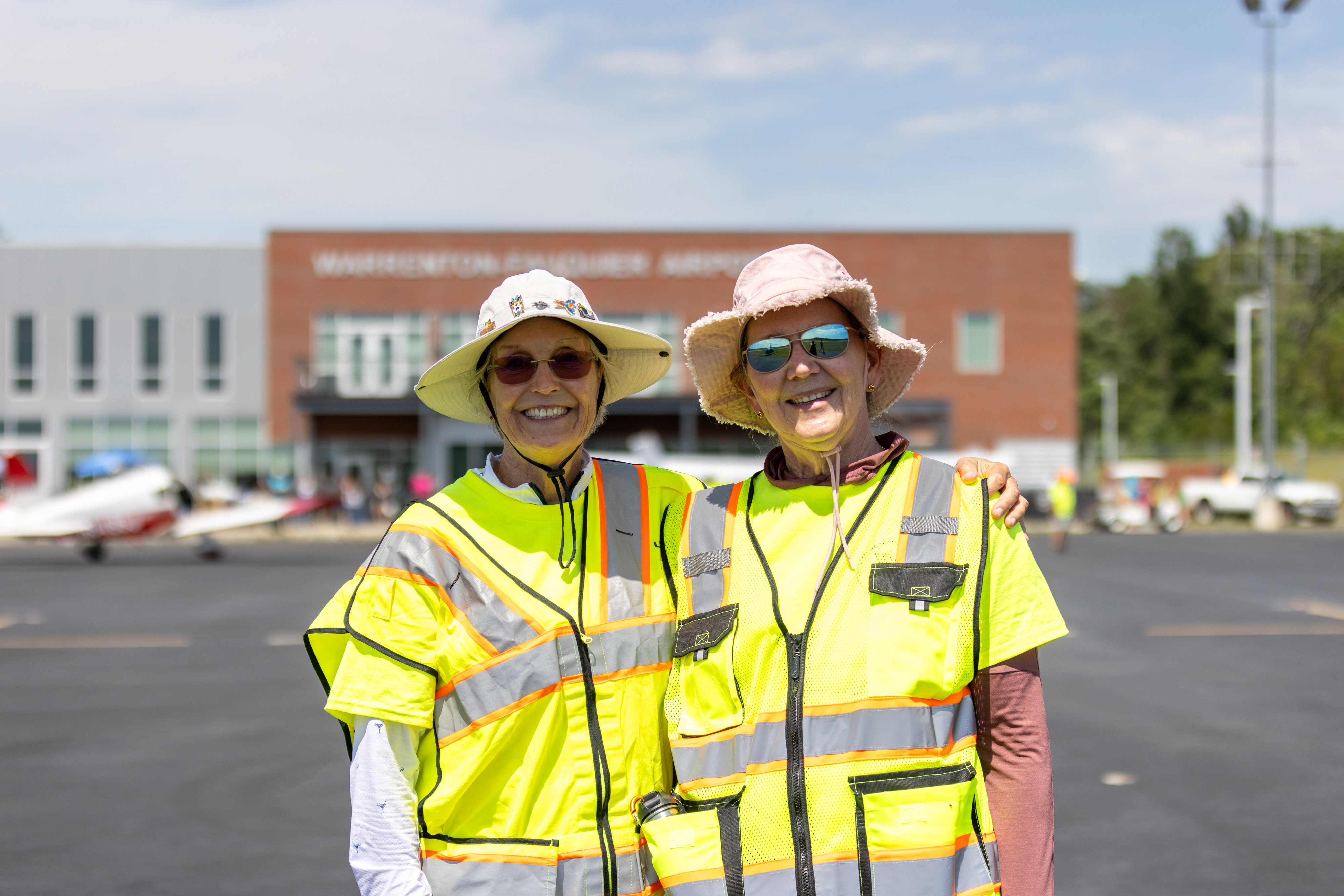 Cynthia Axell and Sue Passmore, members of the Virginia chapter of The Ninety-Nines, volunteer on the ramp. Photo by Rebecca Boone.
