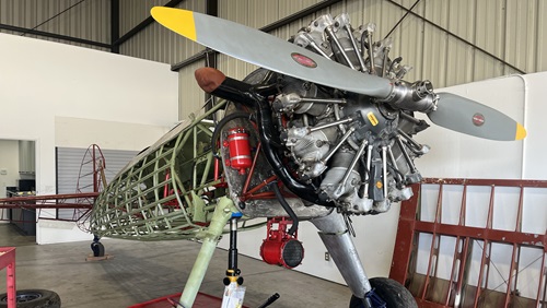 A World War II Stearman (and former AOPA cover model) under restoration provides mechanics and apprentices with another opportunity to develop hands-on skills while preserving aviation history. Photo by Janine Canillas.