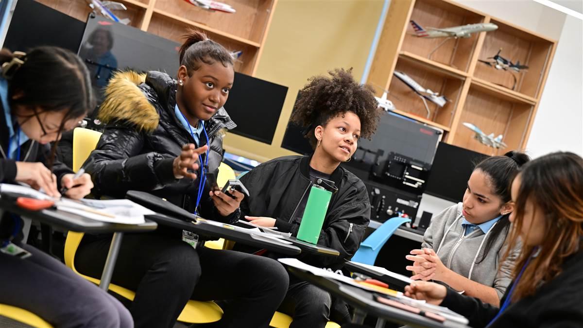 Students at Gregorio Luperon High School in New York City engage in a lesson from AOPA's High School Aviation STEM Curriculum in February 2023. More than 1,500 schools have joined the donor-funded program to date. Photo by David Tulis.