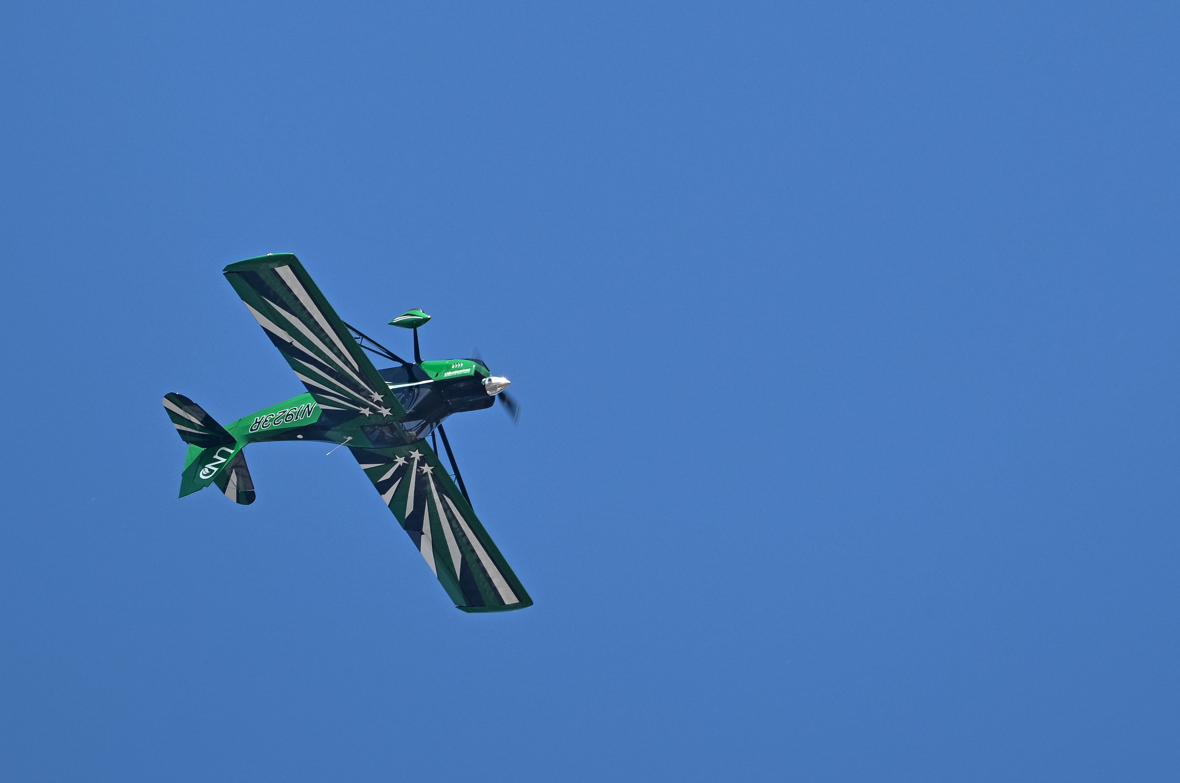 An International Aerobatic Club demonstration during the opening day airshow includes an American Champion Aircraft Super Decathlon with a performance by Michael Lents. Photo by David Tulis.