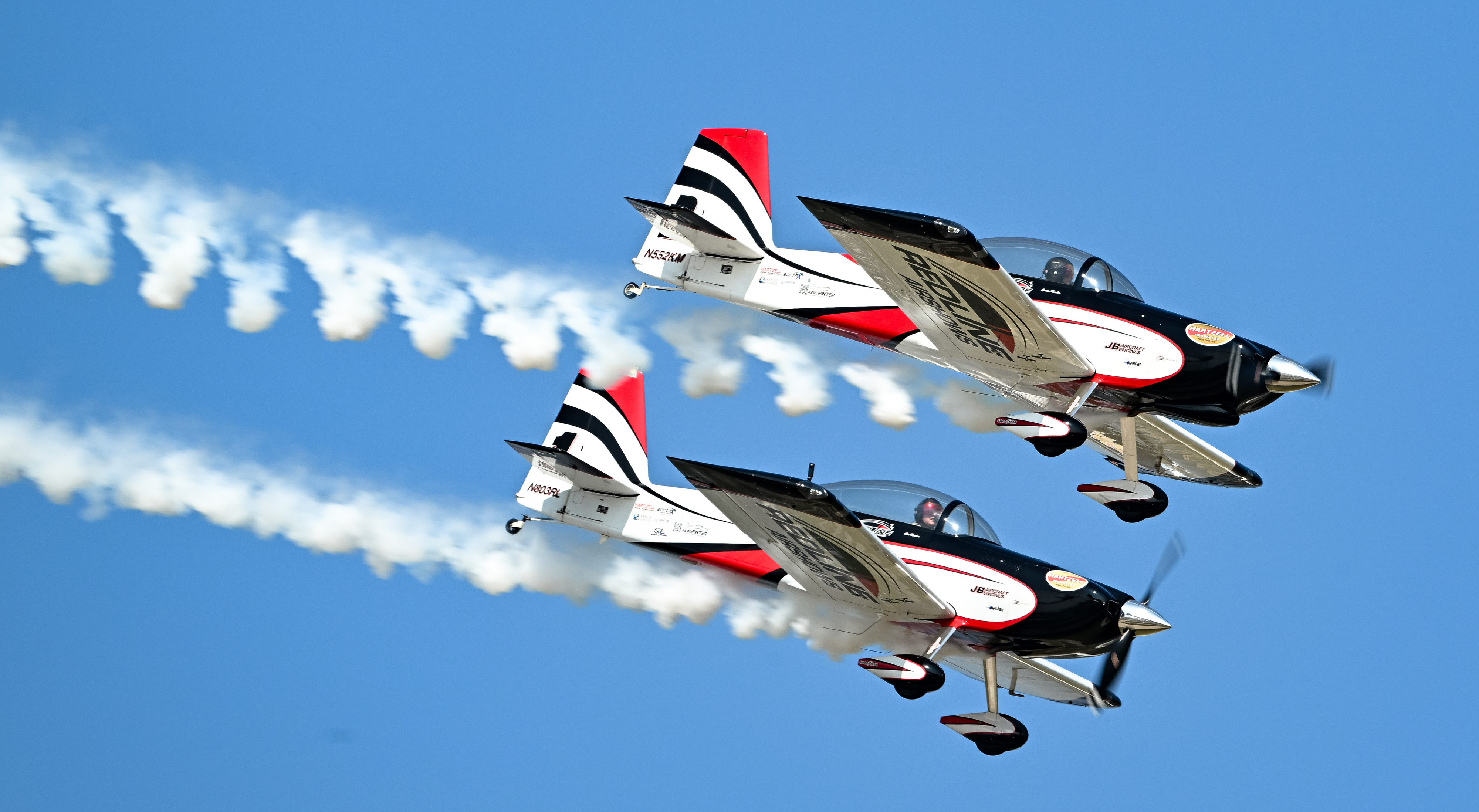 Redline Airshows father-and-son pilots Ken and Austin Rieder perform side-by-side. Photo by David Tulis.