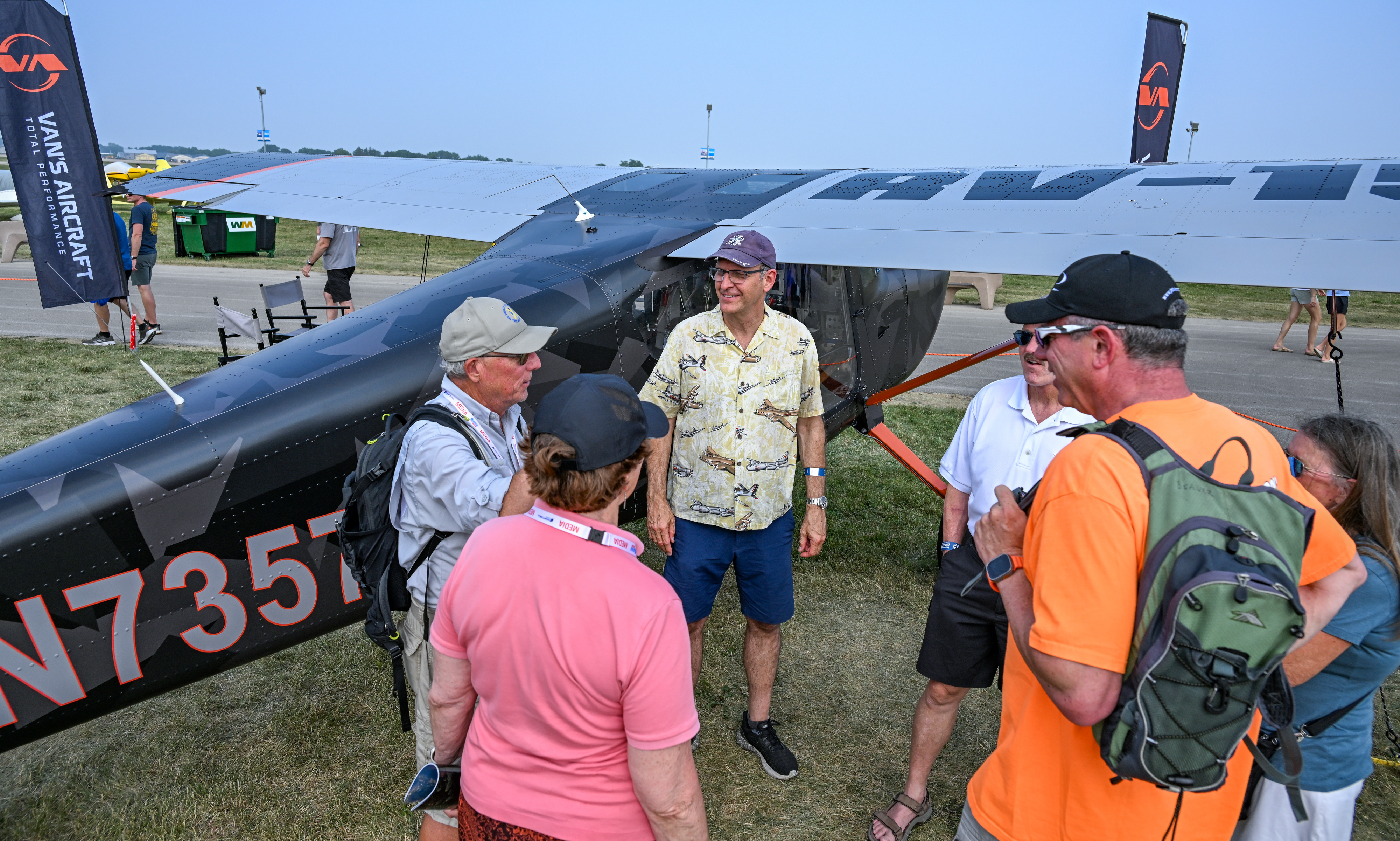 Pilots gather near a Van’s Aircraft RV-15. Photo by David Tulis.