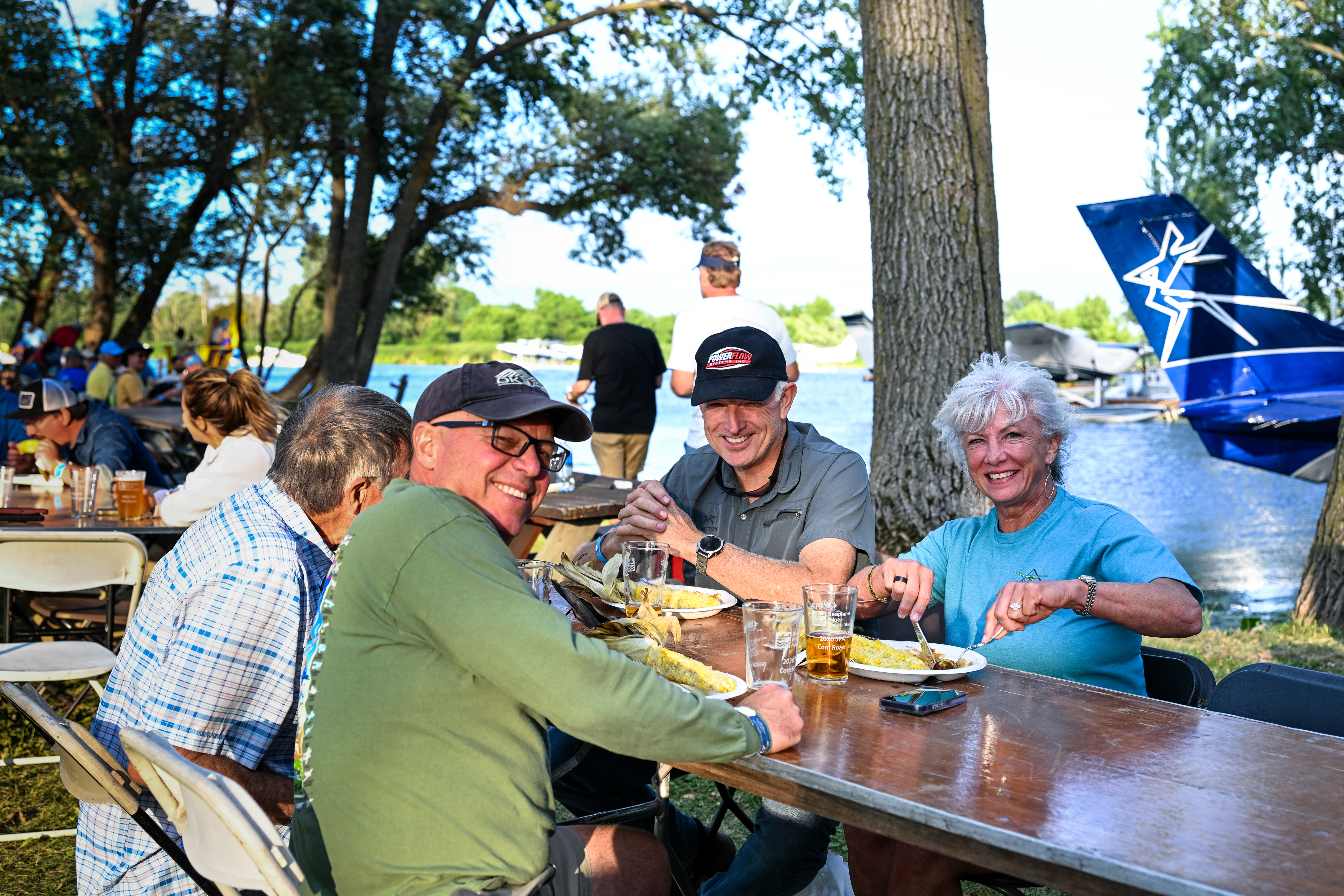 Pilots dig in at the Seaplane Pilots Association’s annual corn roast. Photo by David Tulis.