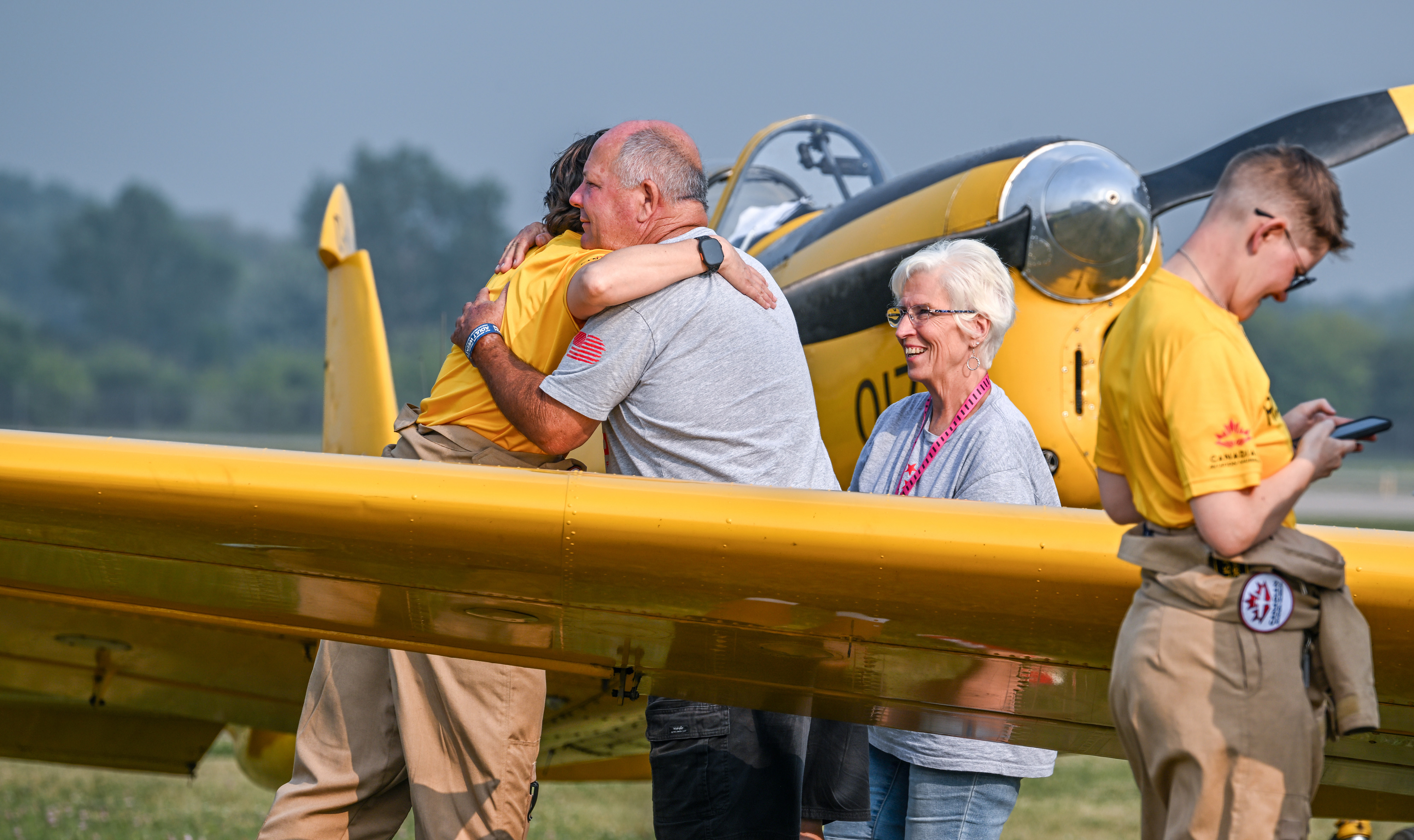 Pilots flying de Havilland Chipmunks greet well-wishers after arriving. Photo by David Tulis.