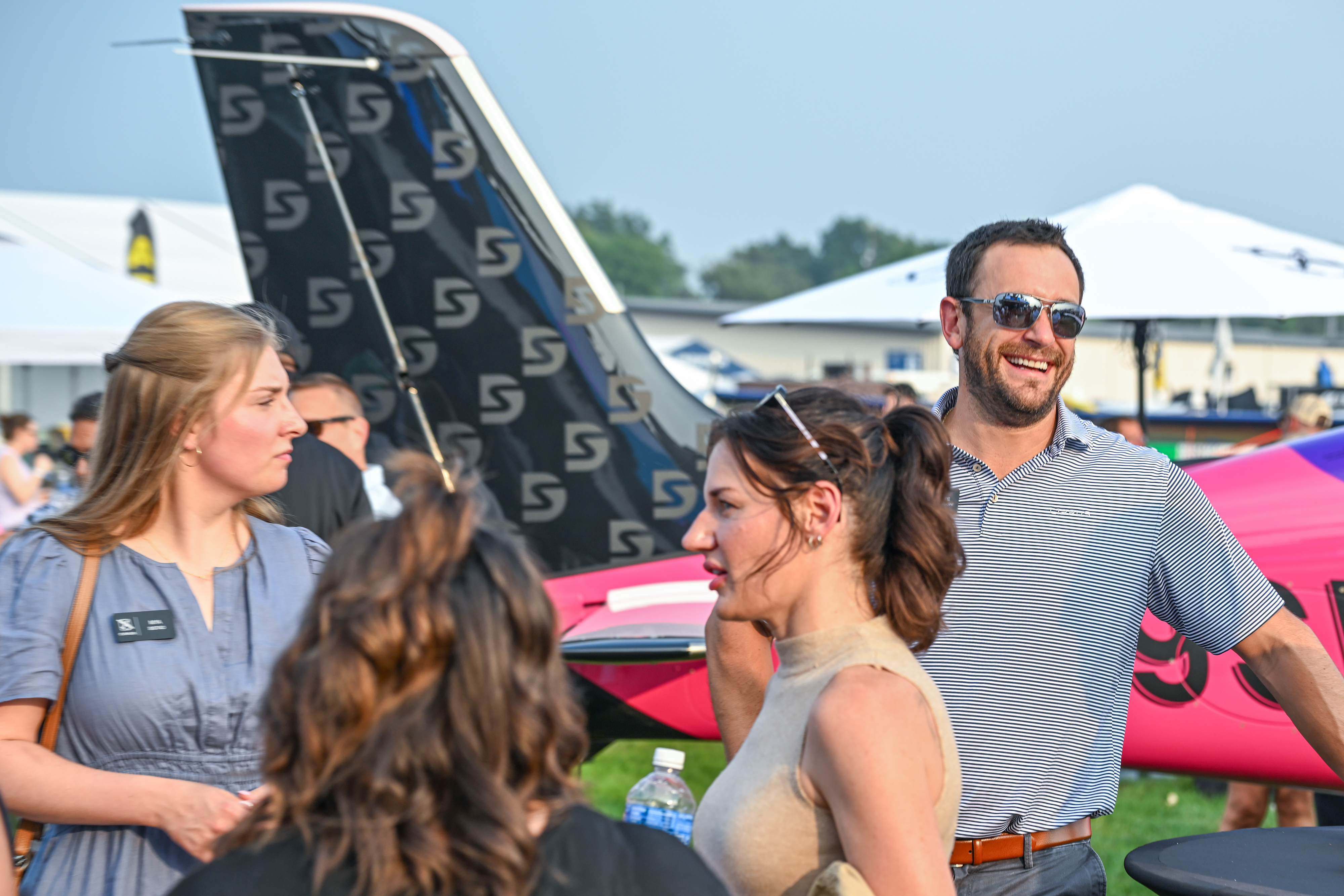Attendees participate in the Cirrus Aircraft welcome party on July 19. Photo by David Tulis.