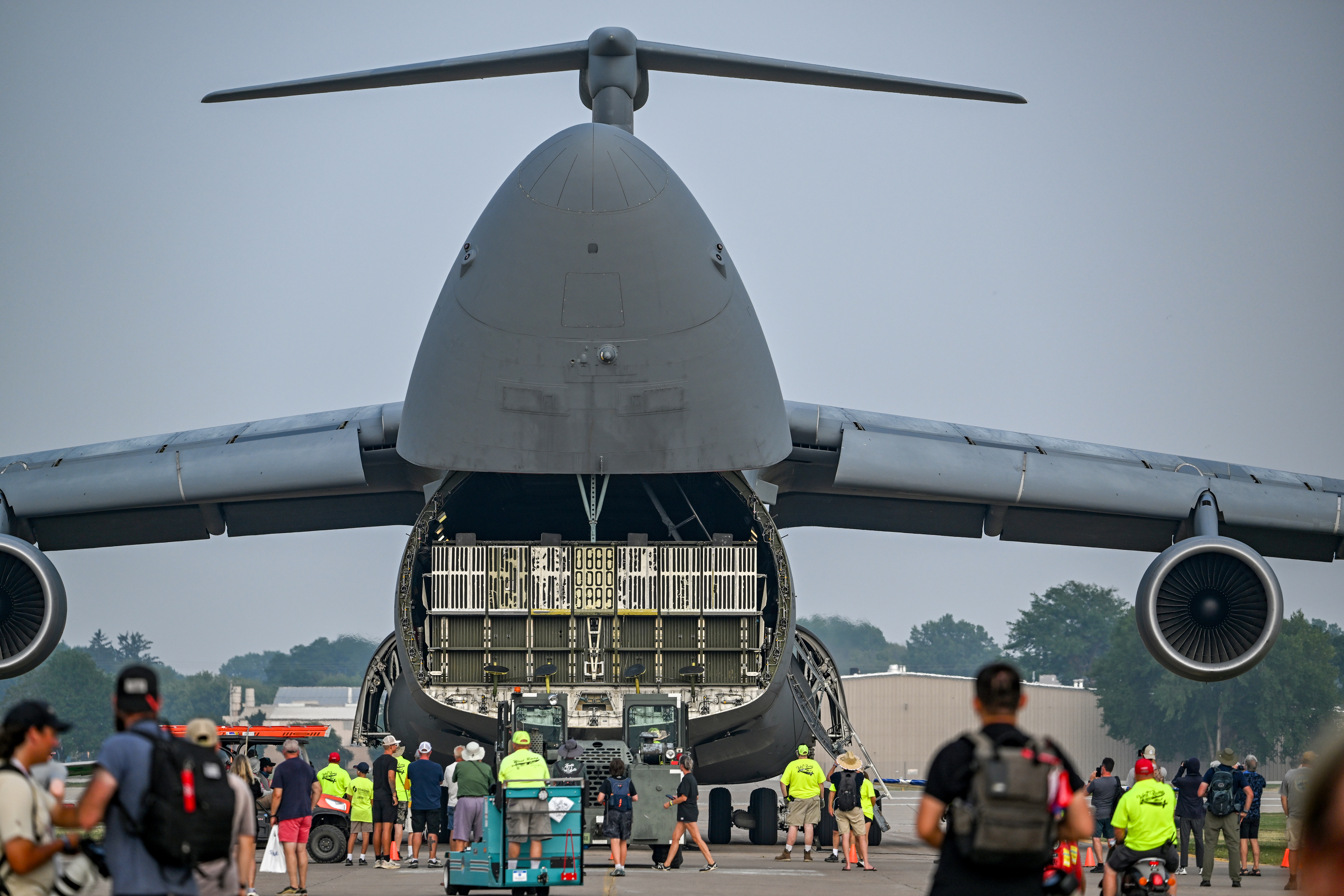 The massive nose of a Lockheed C-5 Galaxy military transport reveals a cargo bay as it is ramped on Boeing Square. Photo by David Tulis.