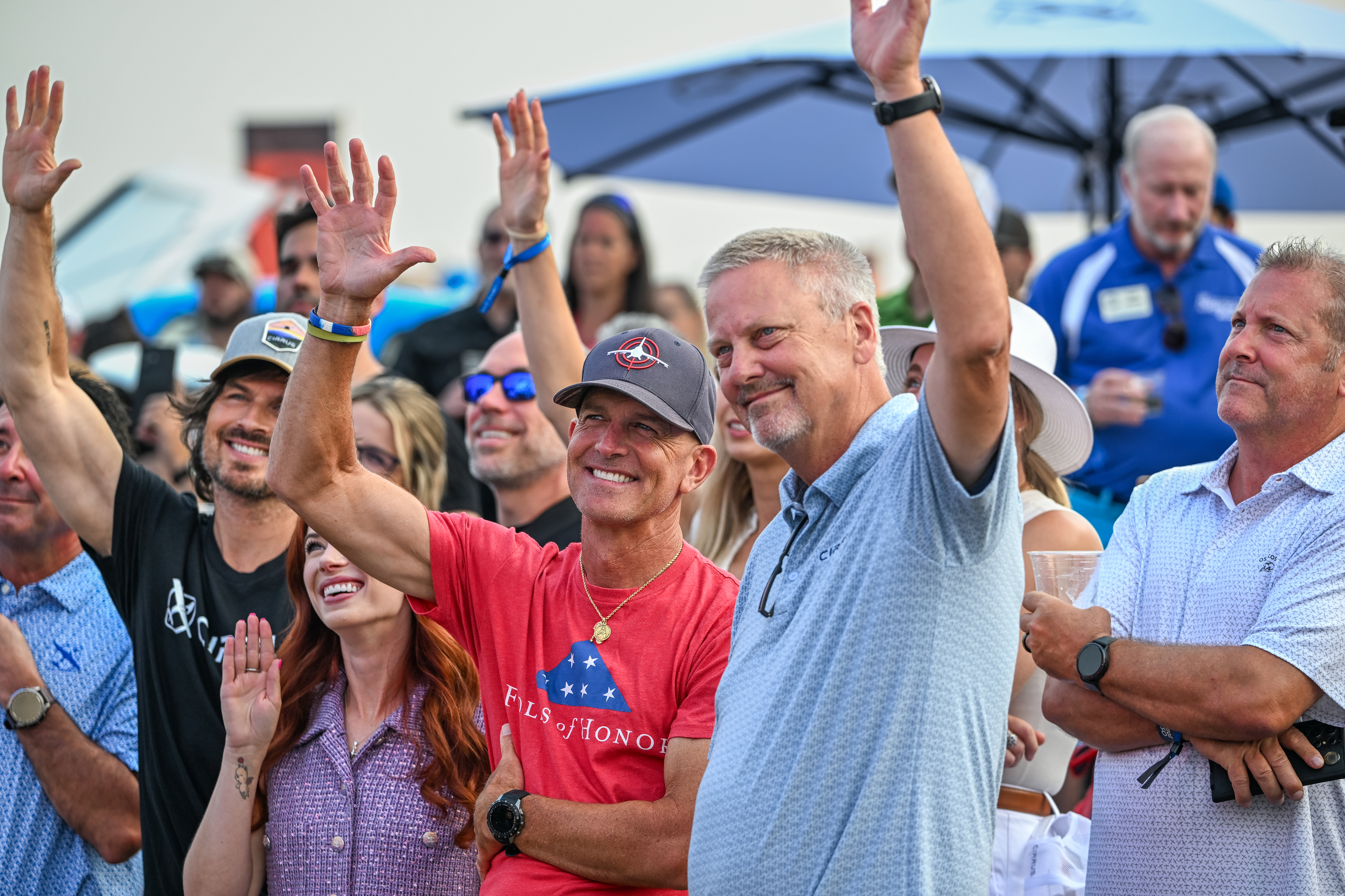 Cirrus Aircraft pilots Dale Klapmeier (right), Folds of Honor founder Dan Rooney, content creator Sarah Daniels, and actor Ian Somerhalder are recognized at a welcome party. Photo by David Tulis.