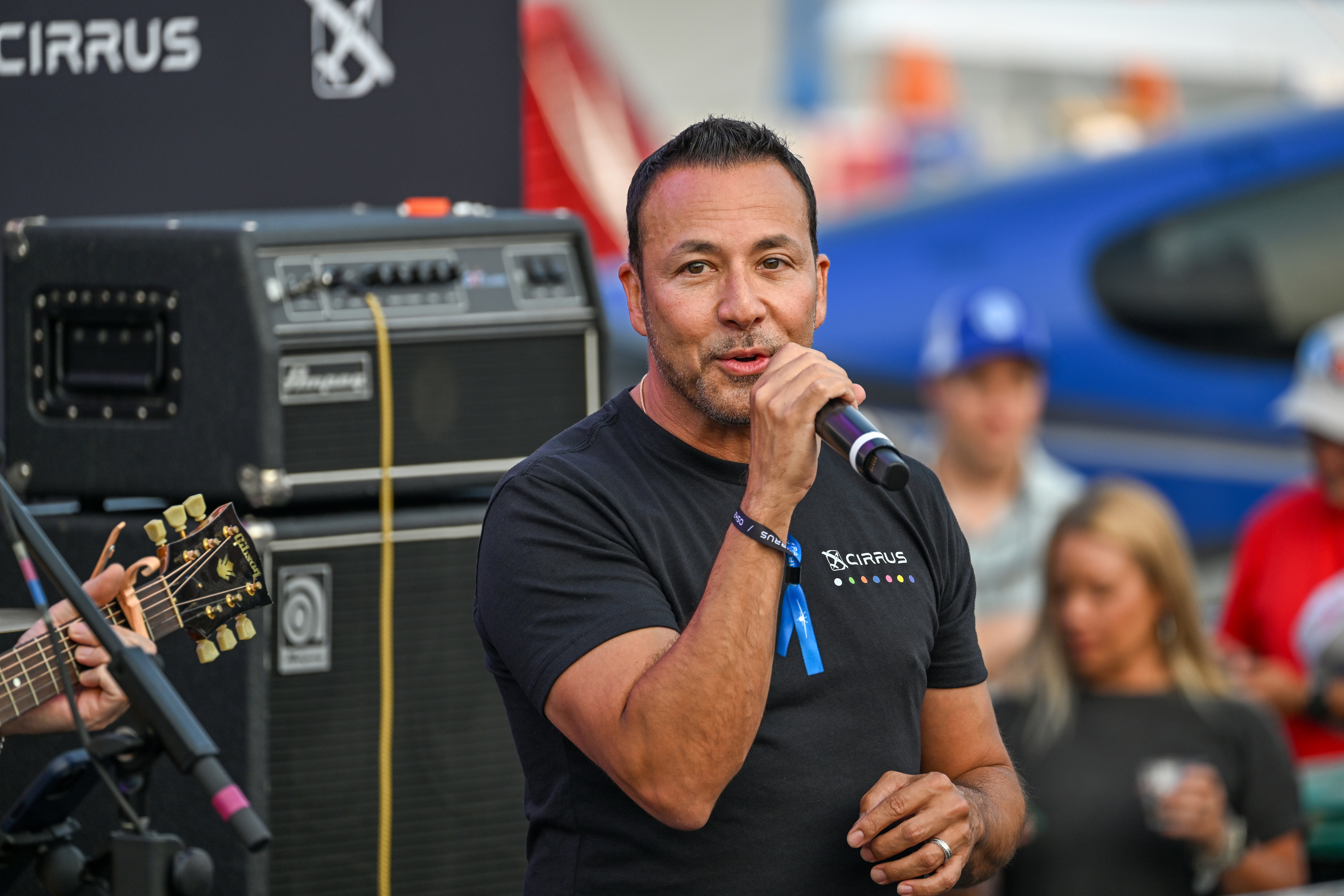 Howie D (Howard Dwaine Dorough) of the Backstreet Boys and a student pilot flying a Cirrus aircraft performs for a welcome event. Photo by David Tulis.