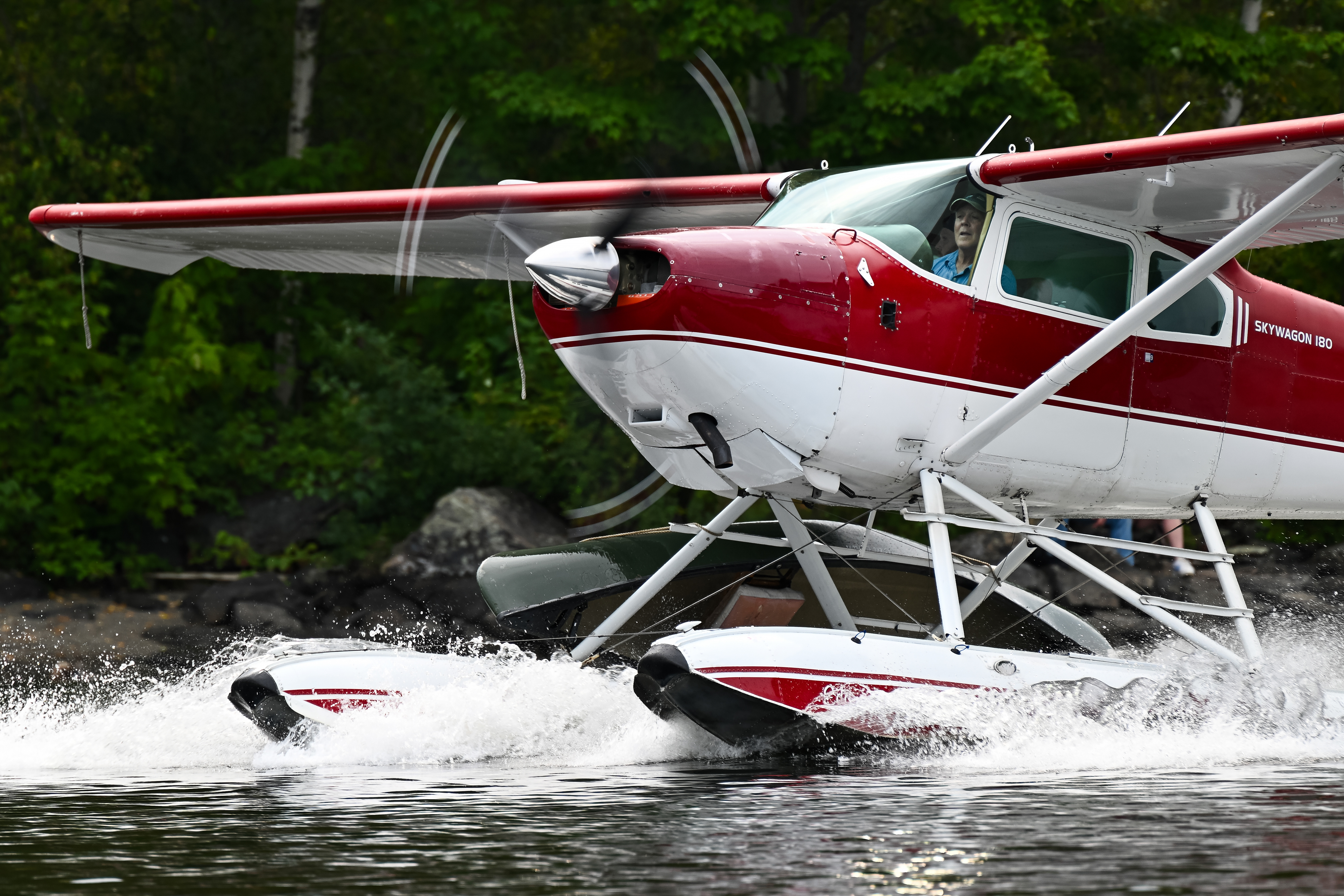 Tommy Dunn water taxis toward the finish line dock. Photo by David Tulis.