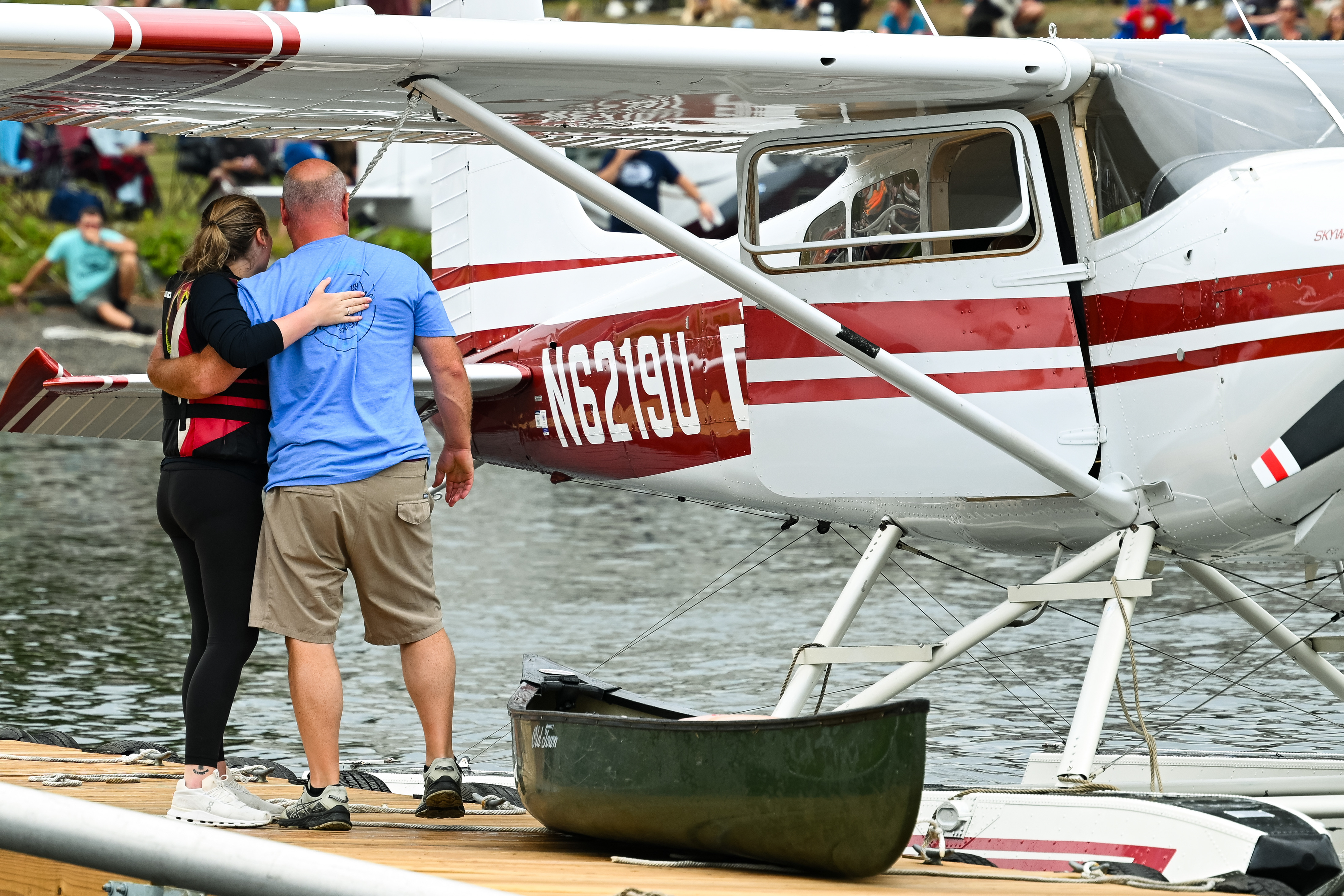 Baily Cust and her uncle, Jeff Hardy, hug after completing the race. Photo by David Tulis.