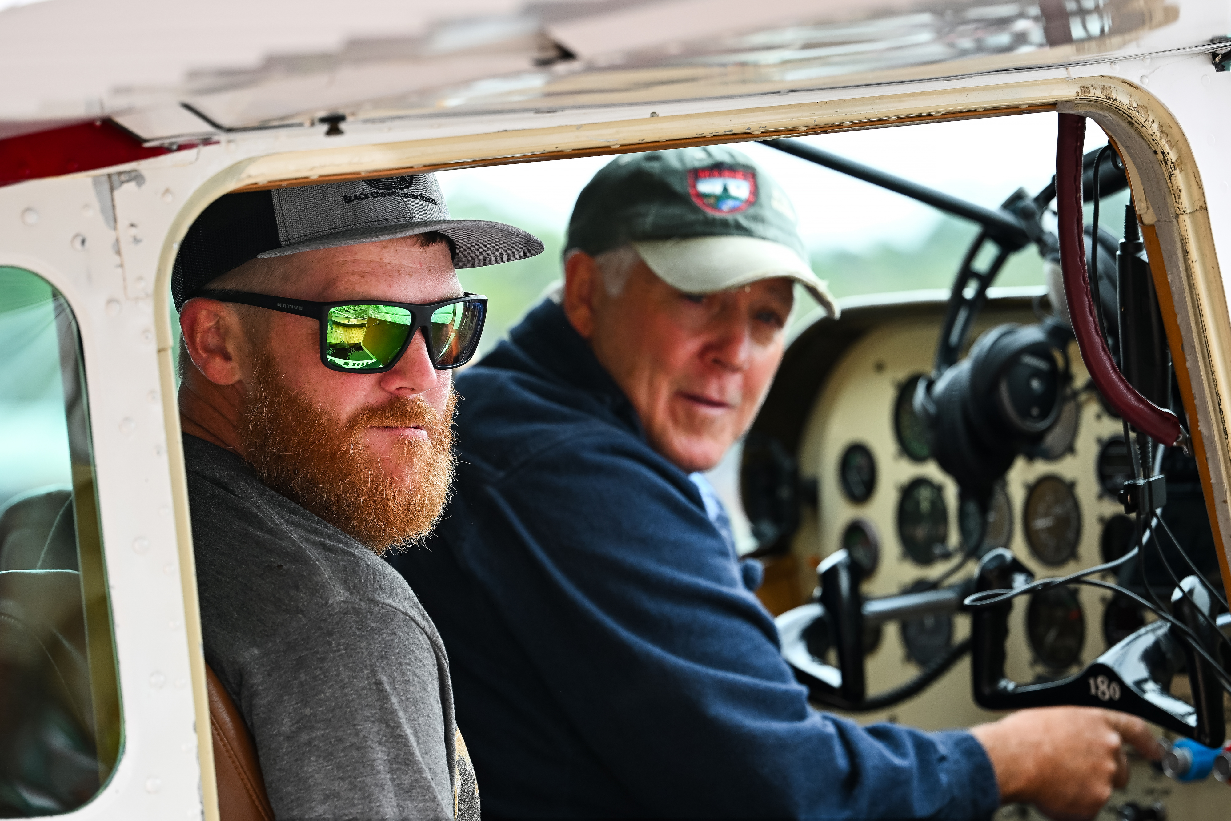 Defending champions Dustin Dunn, with his father Tommy piloting a 1953 Cessna 180 floatplane. Photo by David Tulis.