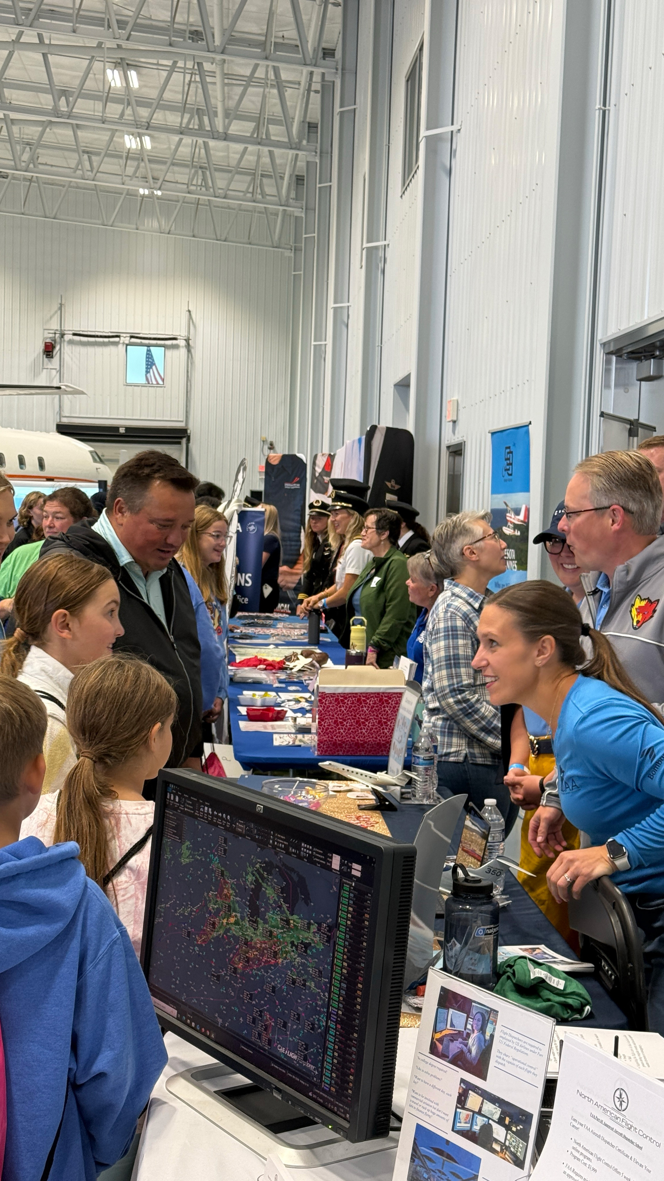 An exhibitor interacts with excited attendees. Photo by Chris Rose. 