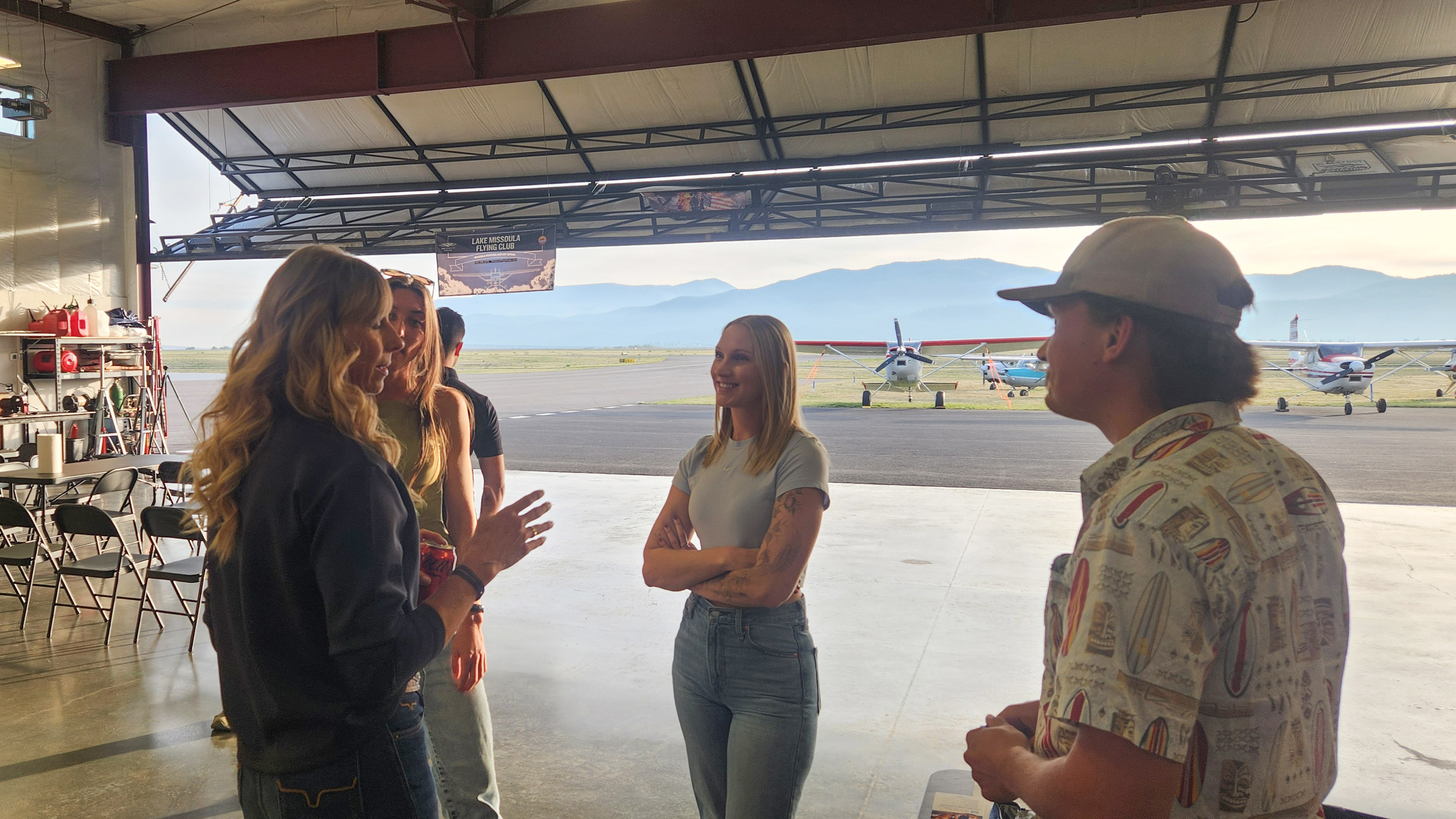 AOPA acting Co-President Katie Pribyl connects with members of the Lake Missoula Flying Club ahead of the event, sharing conversation with fellow aviation enthusiasts. Photo by Katrina Shull.