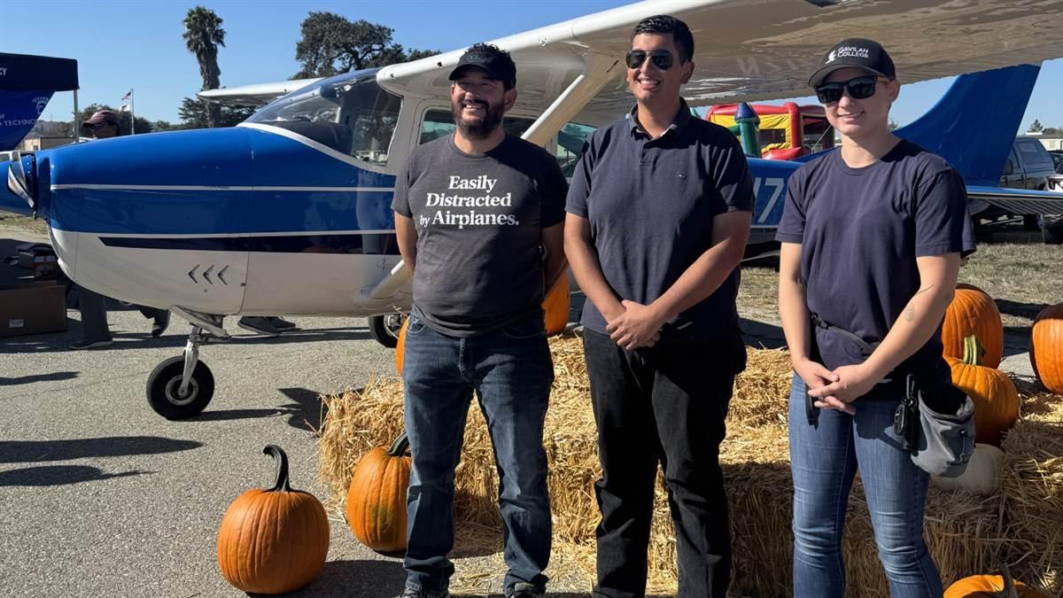 2025 SCAPA Scholarships winners Juan Hernandez, Corinne Arthur, and Brian Hsu accept their awards at the Food Truck Fly-In.  Photo courtesy of Niki Britton. 