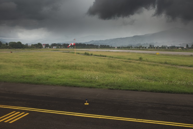 Black lead clouds over the airfield runway - non-flying weather