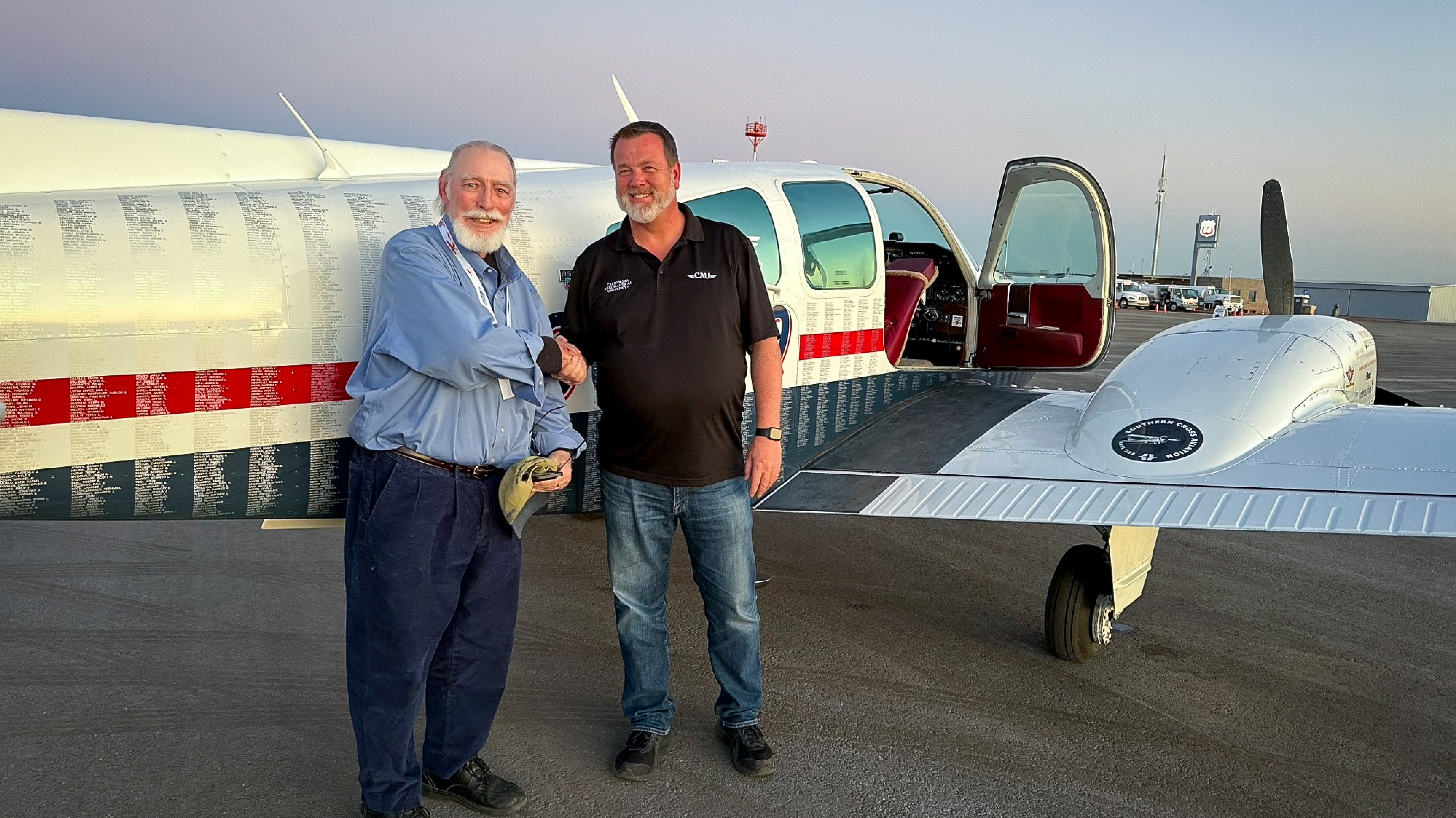 GAMI co-founder George Braly and CAU President Matt Johnston celebrate the University's flight with G100UL at the Buckeye Air Far.