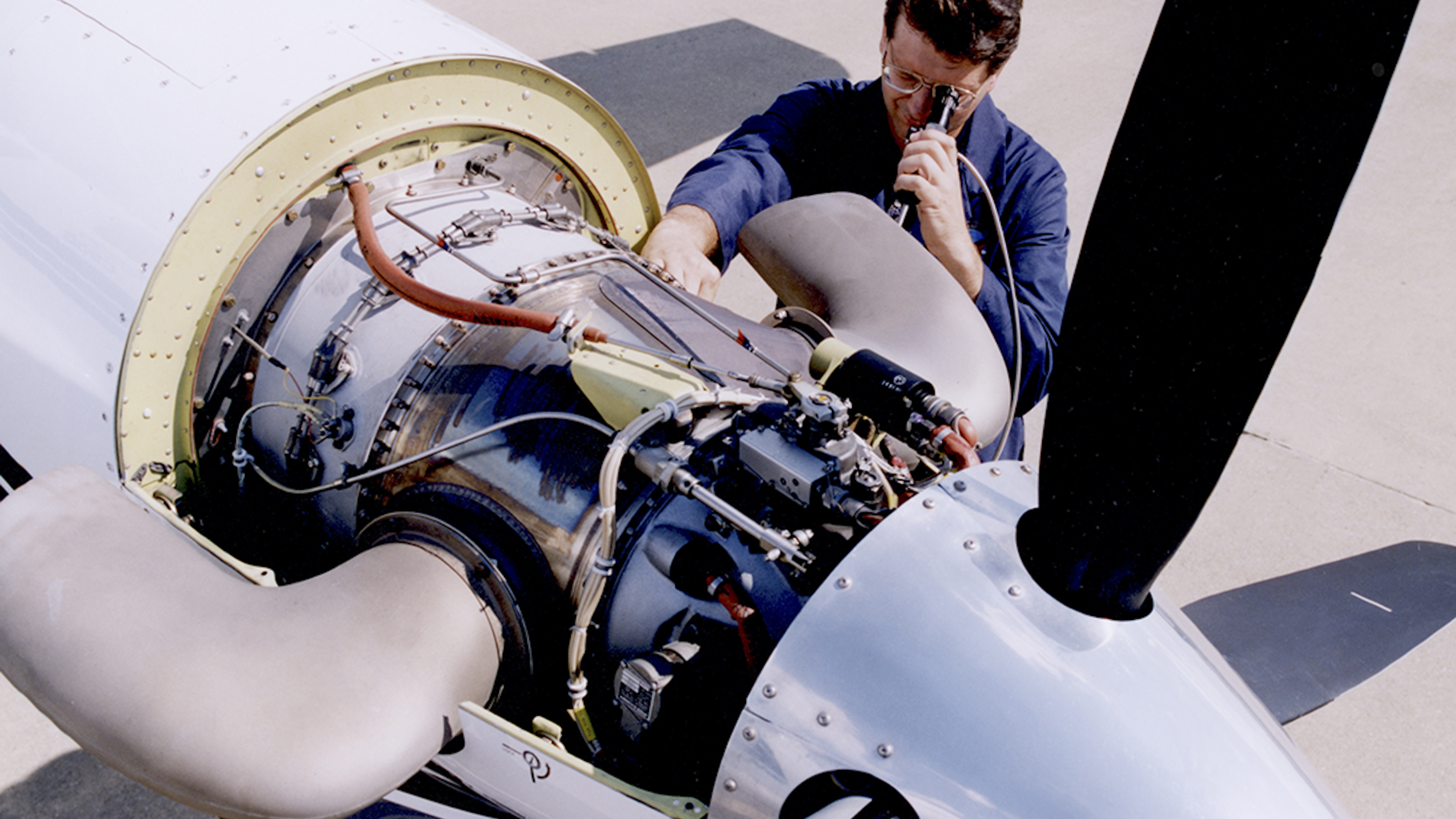 A technician performs a boroscope on a PT6A engine while mounted on the aircraft. Hot Section Inspections on the PT6A can also be conducted while on-wing.