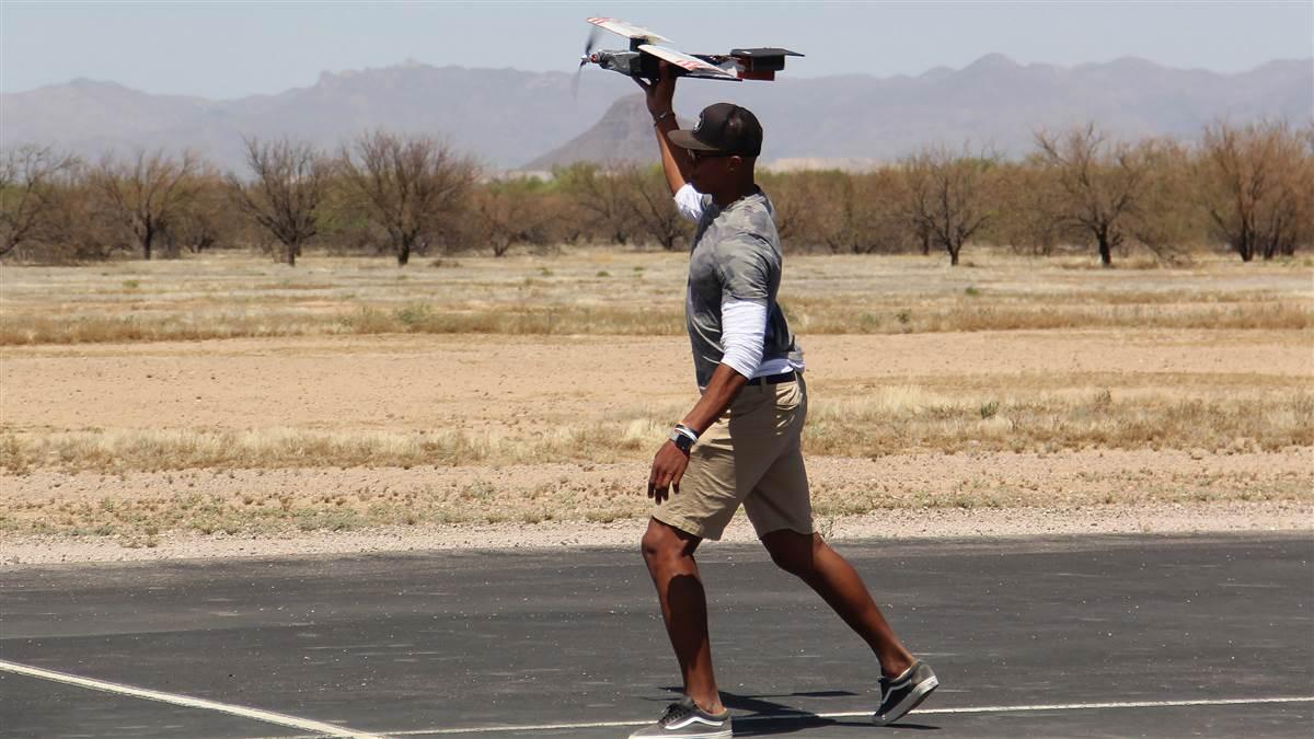 Former University of Tennessee quarterback Joshua Dobbs throws a model aircraft in the design, build, fly American Institute of Aeronautics and Astronautics (AIAA) competition in Tucson, Arizona. Photo courtesy of AIAA.