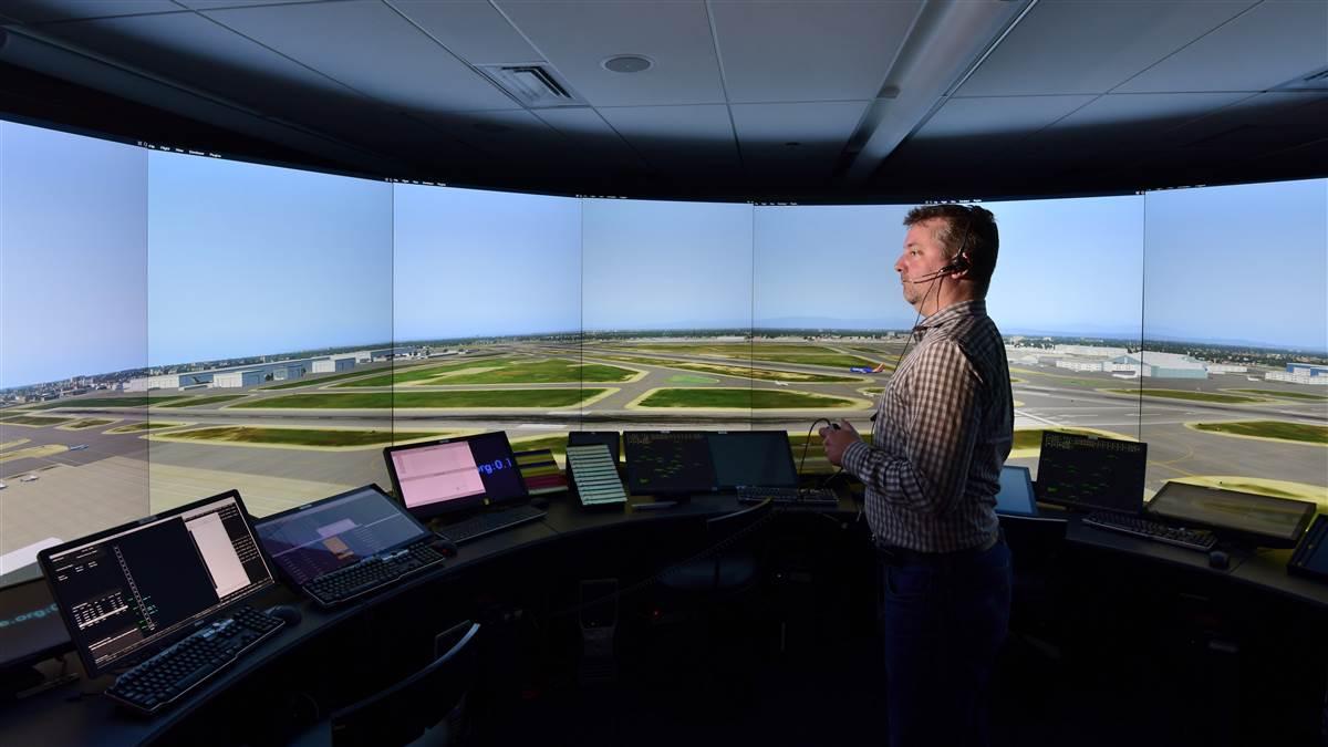 MITRE engineer Jason Giovannelli fills in as an air traffic controller in the IDEA Lab’s virtual control tower. 