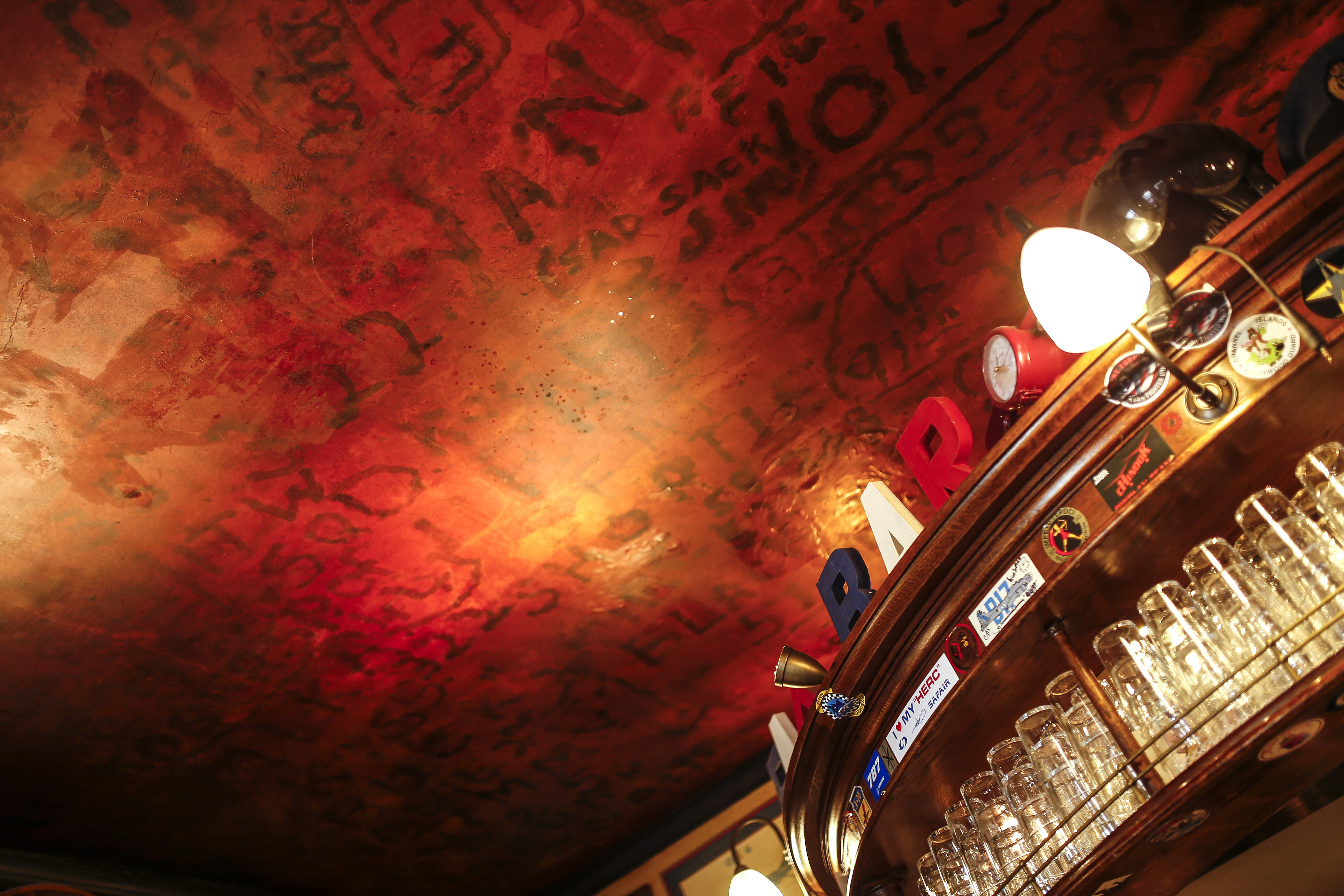 Using candles, markers, and any number of other materials, soldiers for decades have burned and written their unit numbers on the ceiling of the legendary The Eagle pub in Cambridge, England.