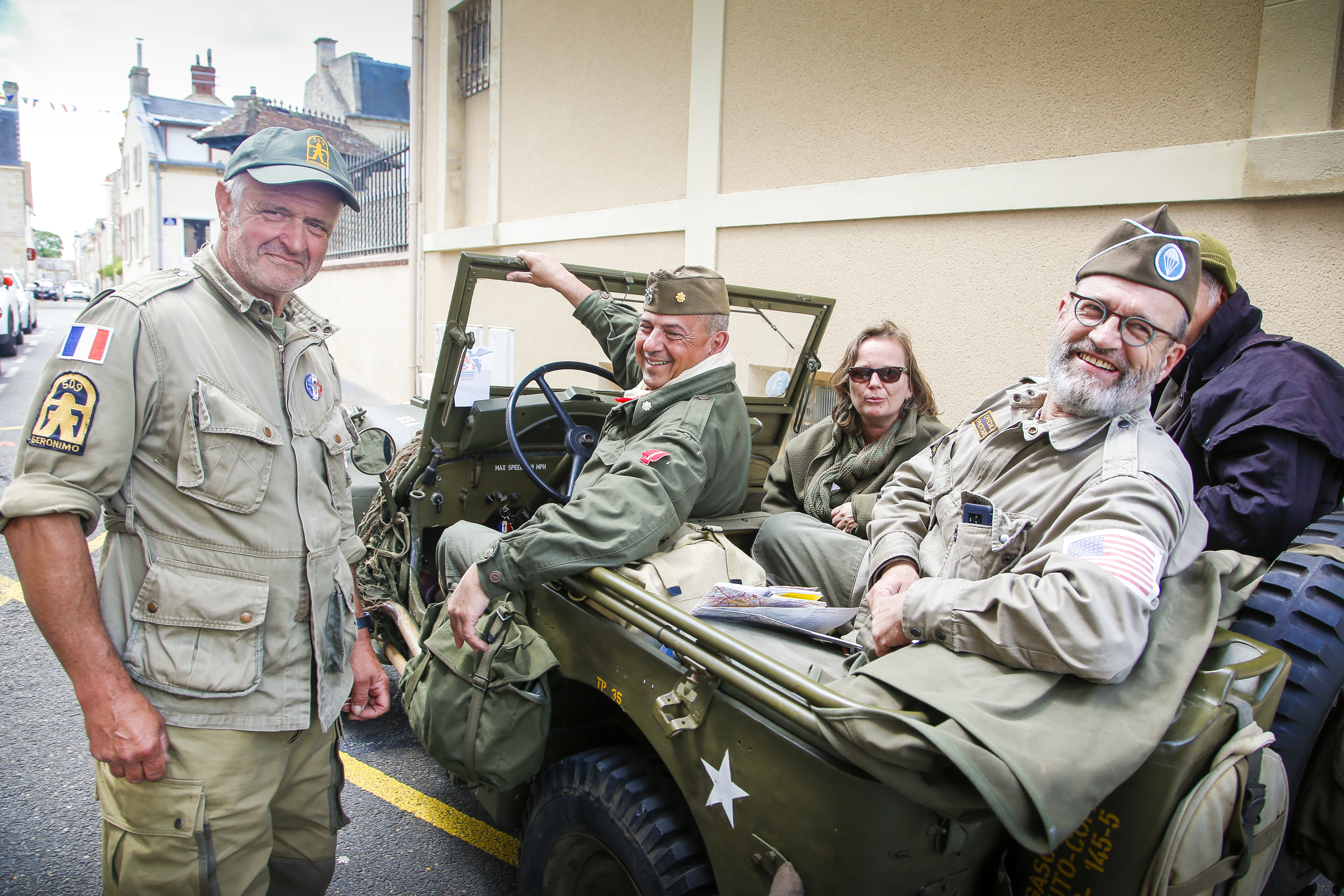 French citizens donned American uniforms and an American-emblazoned Jeep for a tour around Normandy.