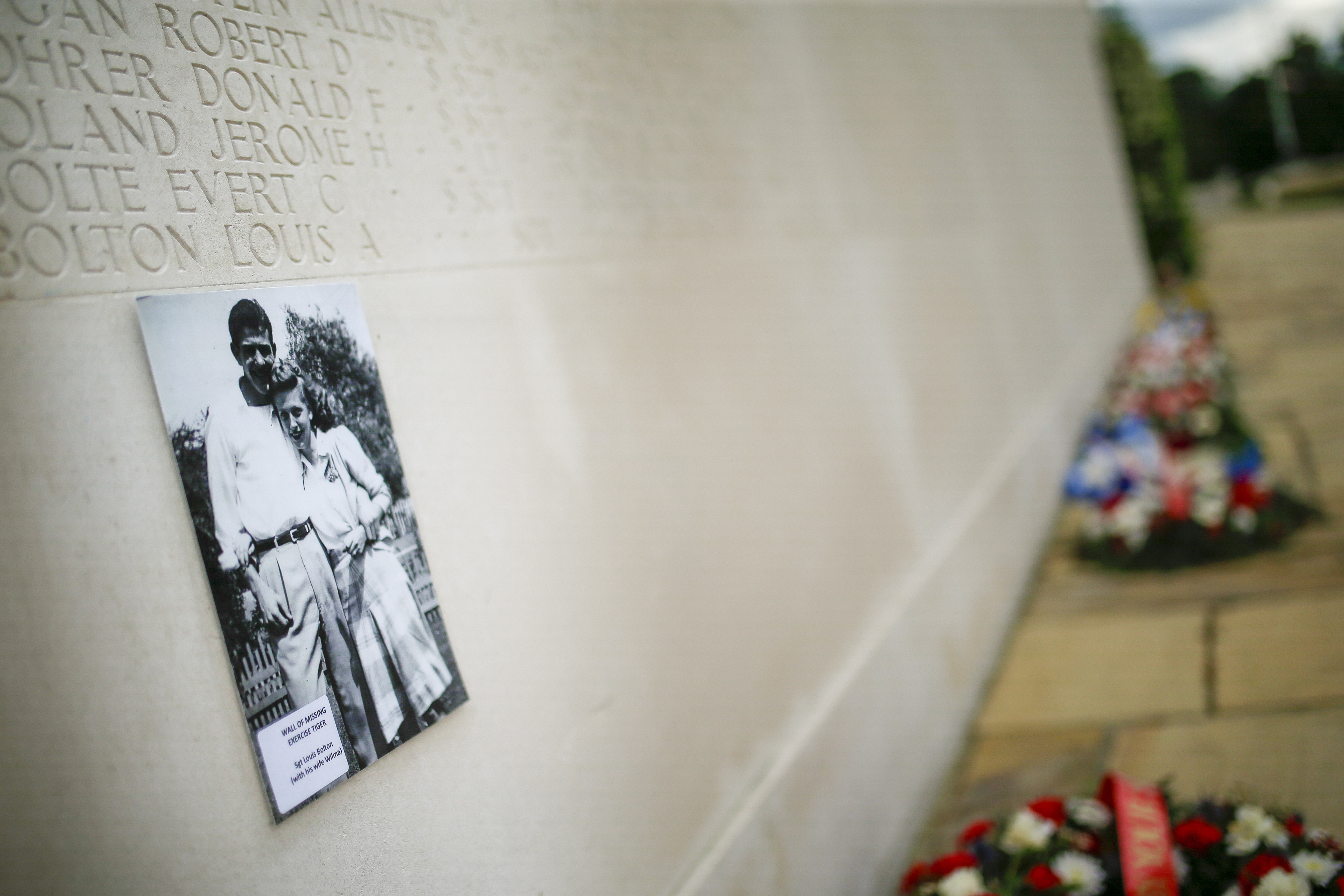 Many friends and family of those lost during the war visited England and France for the first time around the seventy-fifth anniversary of D-Day, many leaving flowers, photos, and momentous along the Wall of the Missing at the Cambridge American Cemetery and Memorial in England.