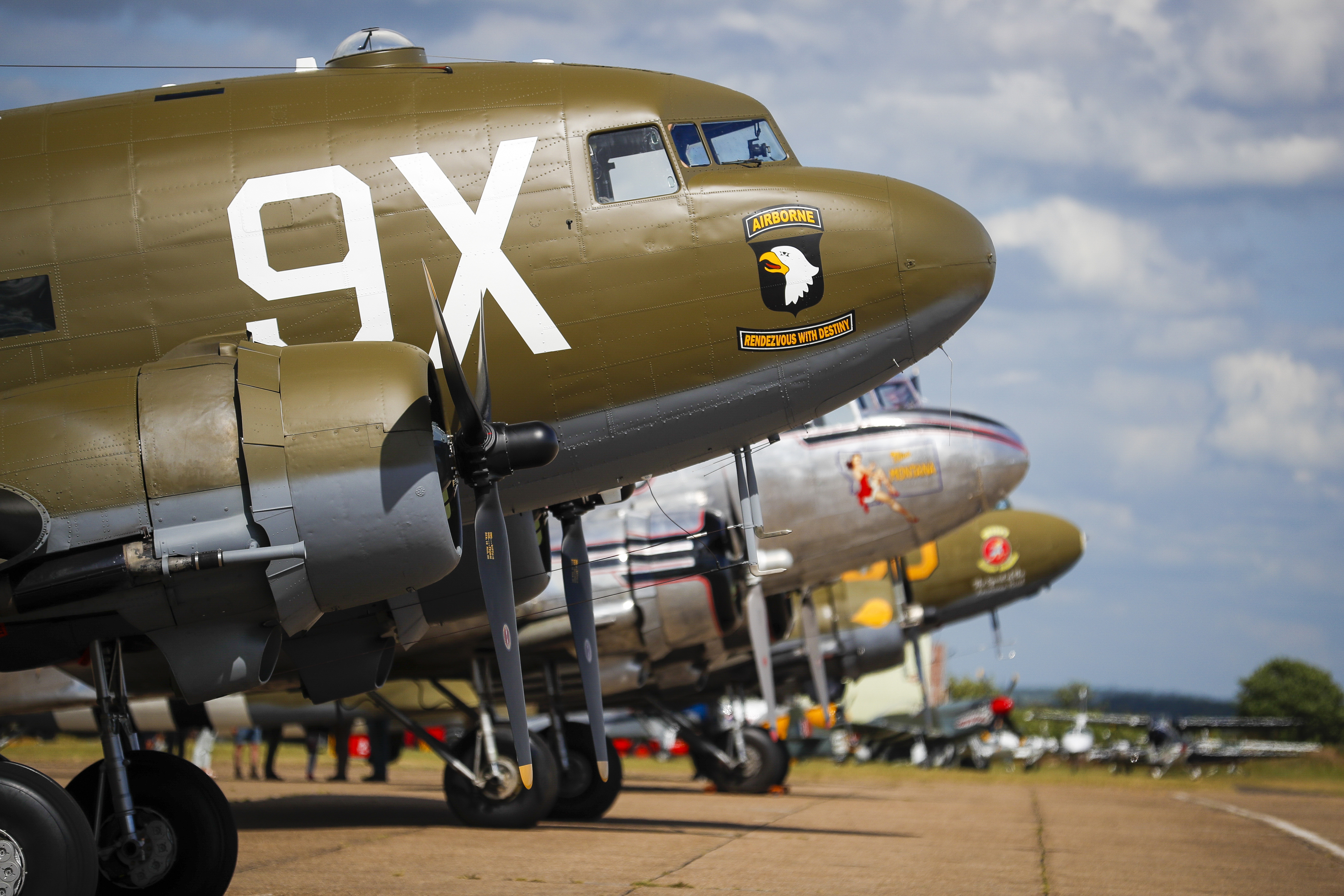 D-Day Squadron DC-3s and C-47s wait for their turn to head to Normandy, France.