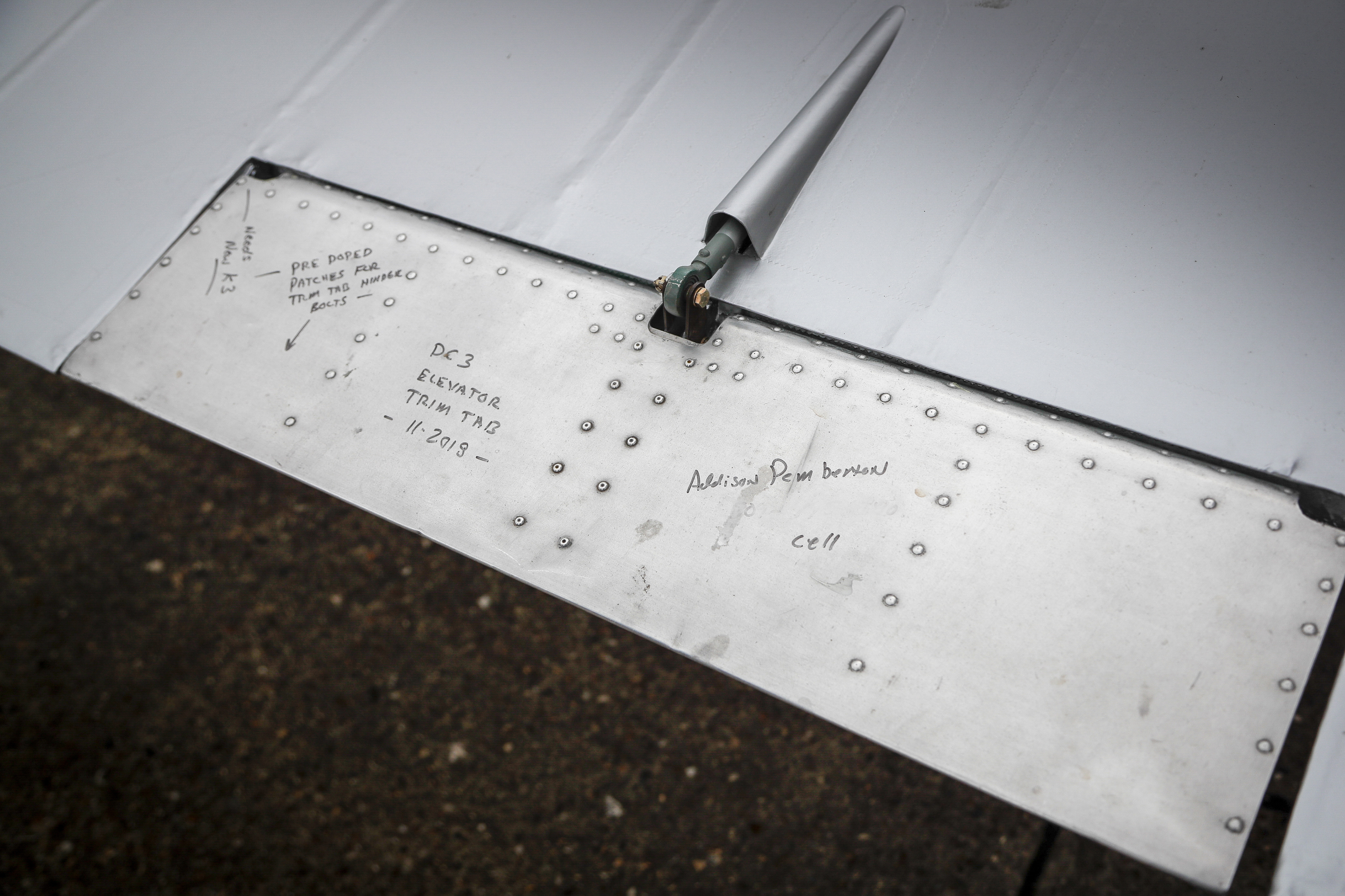 An unpainted elevator trim tab on 'Miss Montana' reflects the hurried nature of her restoration for the D-Day events after not flying for 18 years.