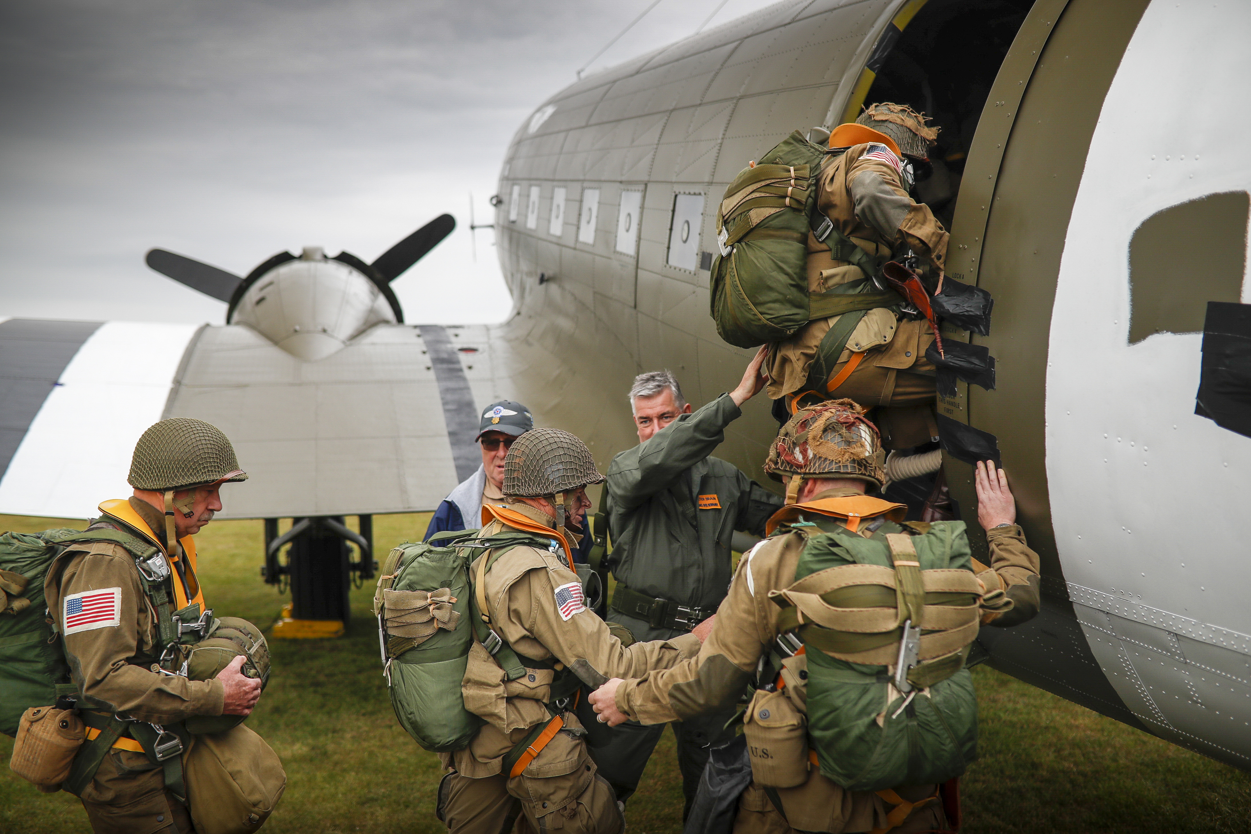 Parachutists in period uniforms load up for the long-anticipated anniversary flight and jumps over Normandy.