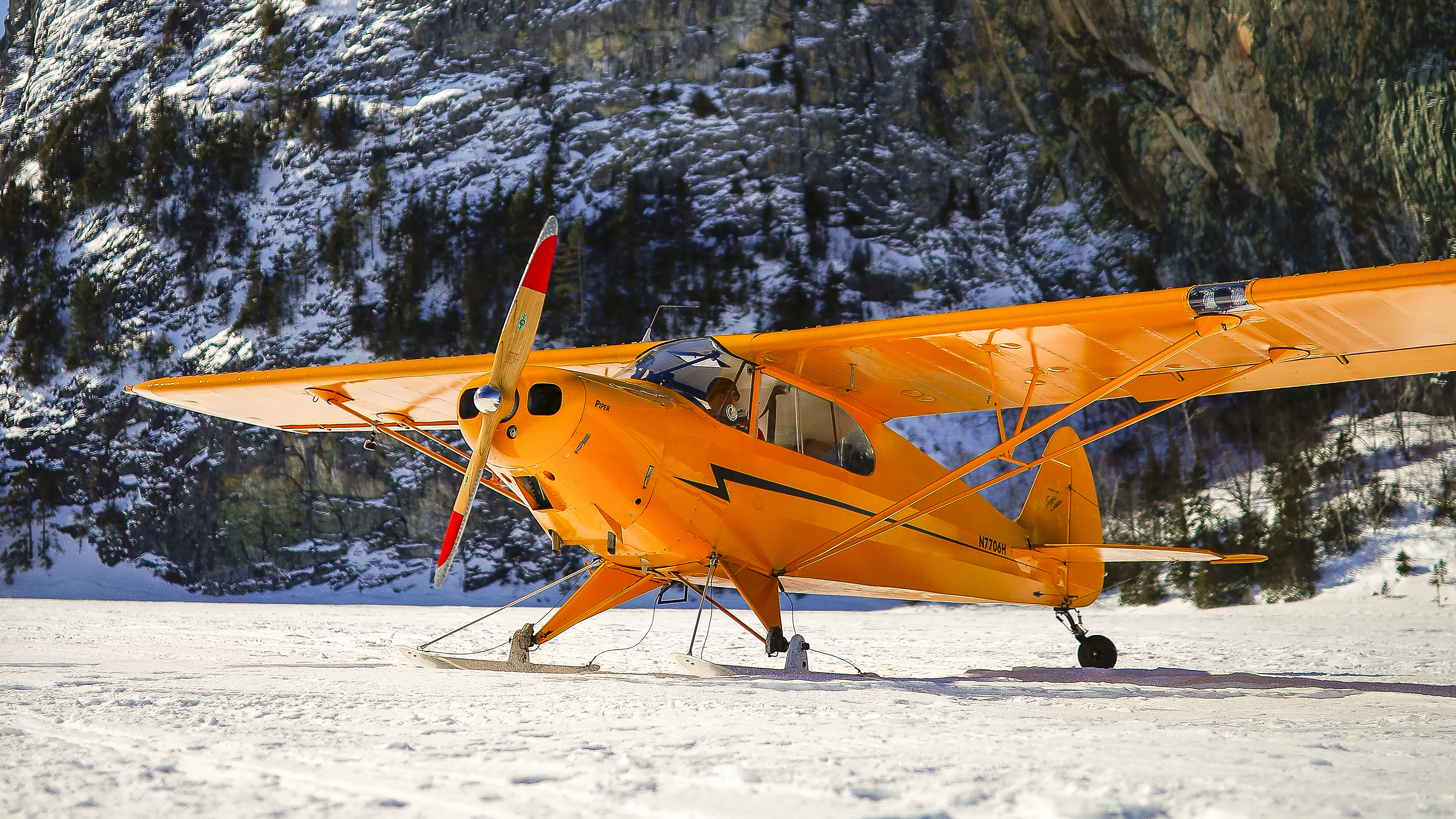 A Piper PA–12 is exceptionally light but with straight skis is limited to snow surfaces for takeoffs and landings.